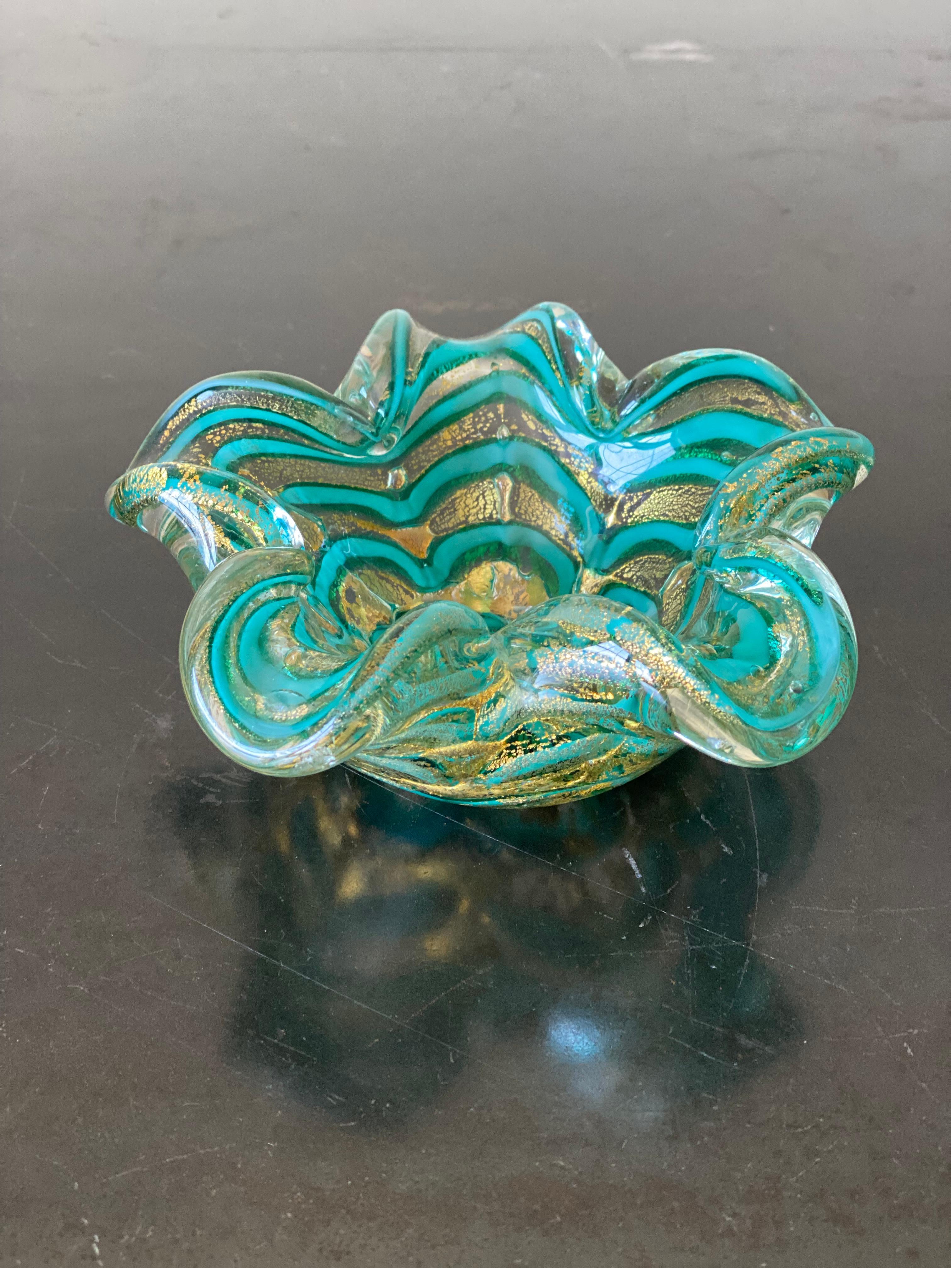 Gorgeous Murano, Italy glass decorative bowl. Hand blown in the shape of a flower. Featuring alternating clear glass and green glass stripes around the floral shape as well as 