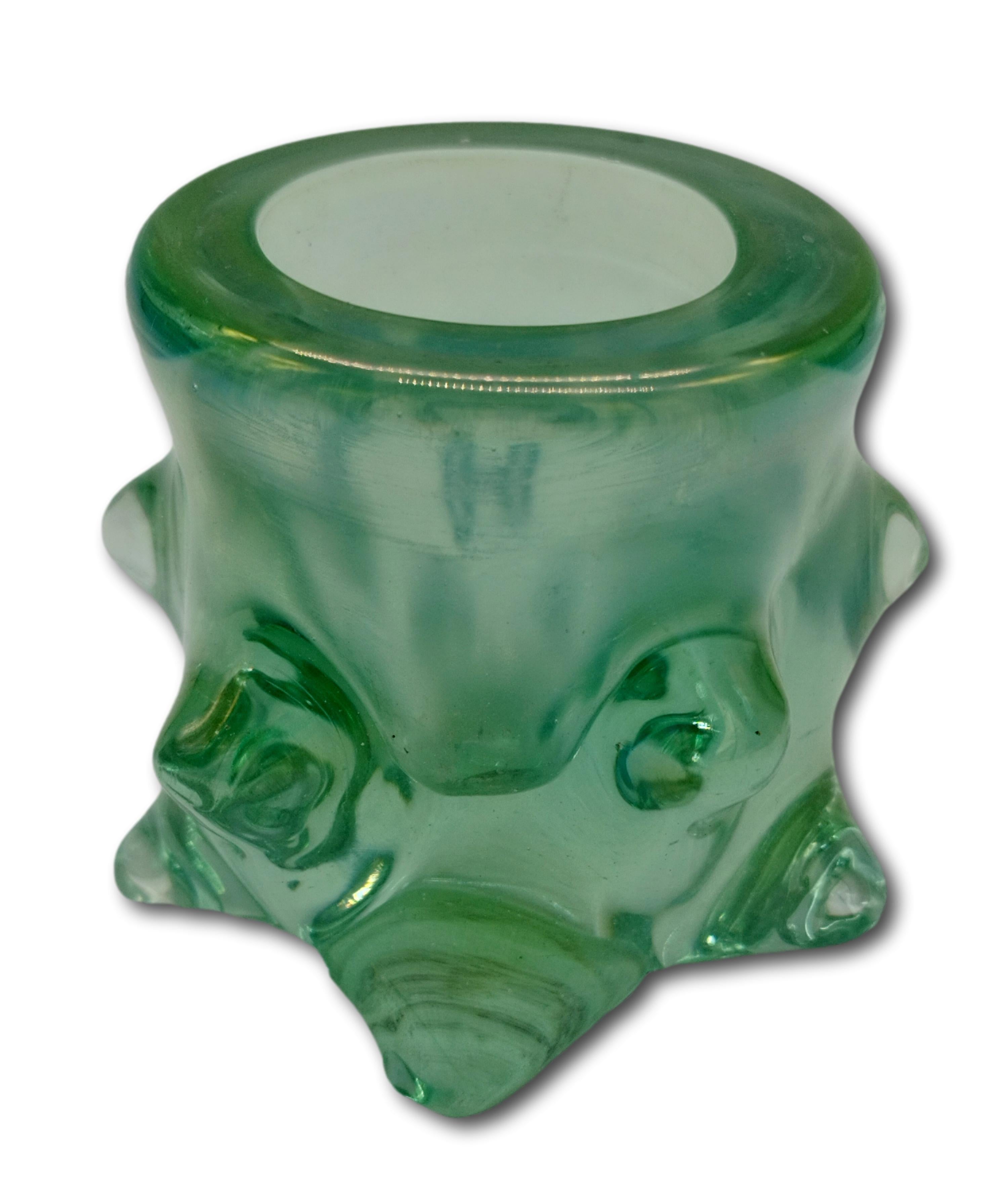
Small vase from the Mugnoni series in heavy green glass decorated with protuberances containing air bubbles.
This vase is a vintage item, so it may show slight signs of use, but it is to be considered as in excellent original condition and ready to