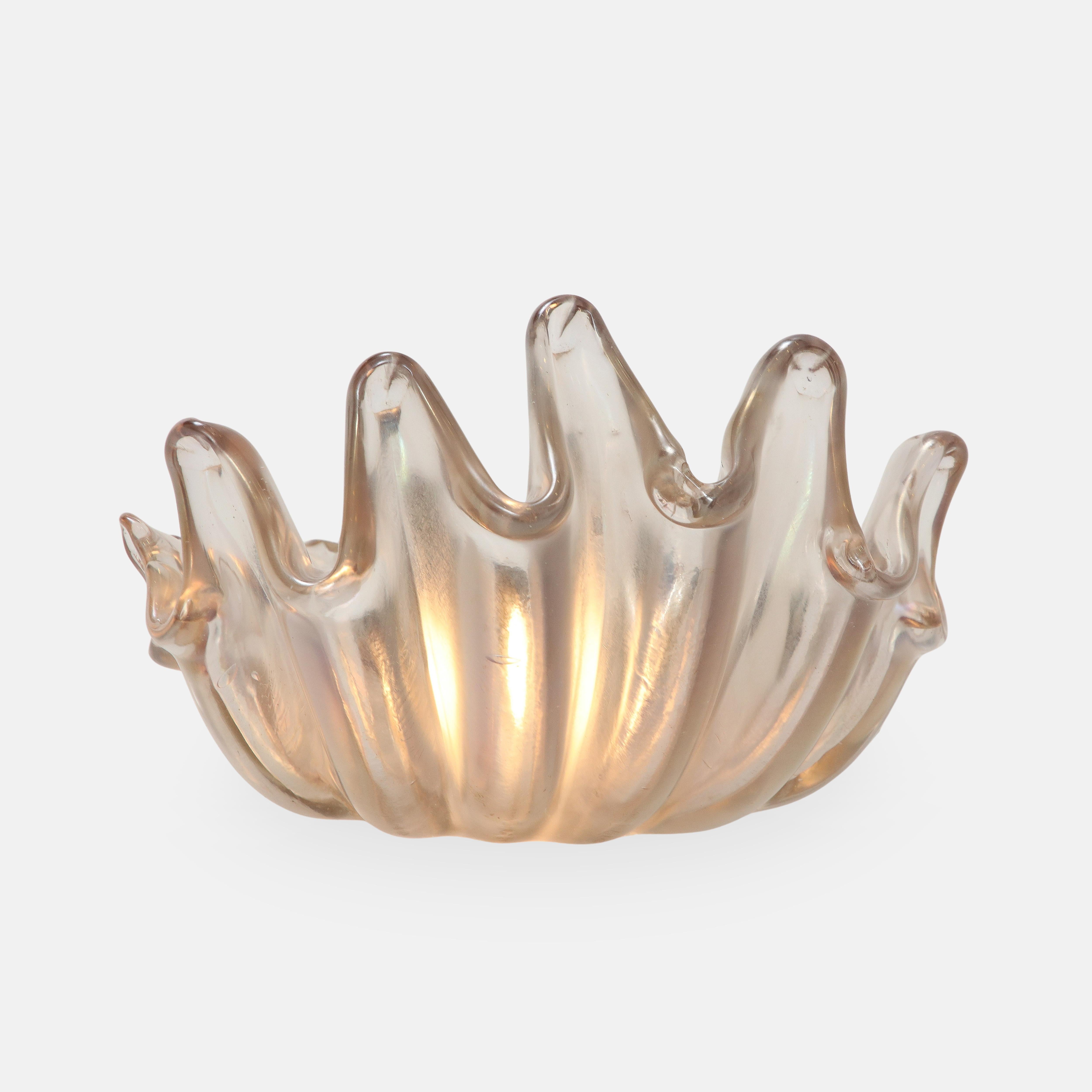 Ercole Barovier for Barovier & Toso large and impressive single shell-shaped sconce in heavy transparent iridescent glass featuring deep ribbing and pronounced lobes with nickel-plated metal backplates, Italy, circa 1940.  
Rewired to U.S. standards