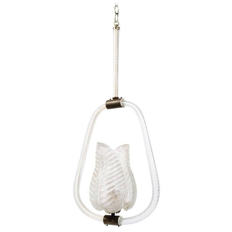 Art Deco glass pendant chandelier with a cage frame and acanthus leaf shades surrounding a center up-light. The chandelier features handblown Murano glass with textured and swirled designs. Fitted with bronze mounts and a brass canopy. Excellent