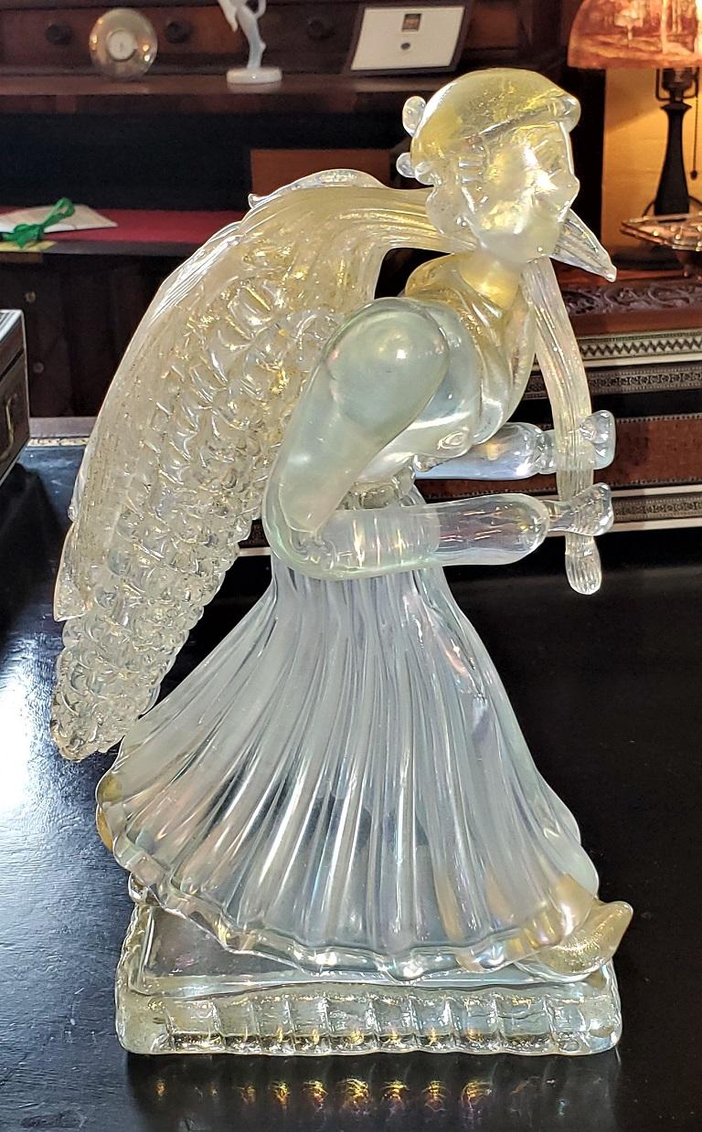 Presenting a lovely Barovier and Toso Murano art glass figure of a woman carrying a large corn on the cobb.

By the world renowned maker of Barovier & Toso and probably made in the 1960’s.

Gorgeous frosted glass with 24 carat gold flecks and