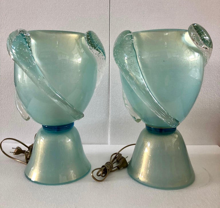 Splendid Barovier & Toso table lamps in Murano glass. Note the beautiful hot-attached stretched drops. A supreme light turquoise color, with some gold inside.

Murano lamps are composed of a large cup in the shape of an amphora, to which large glass