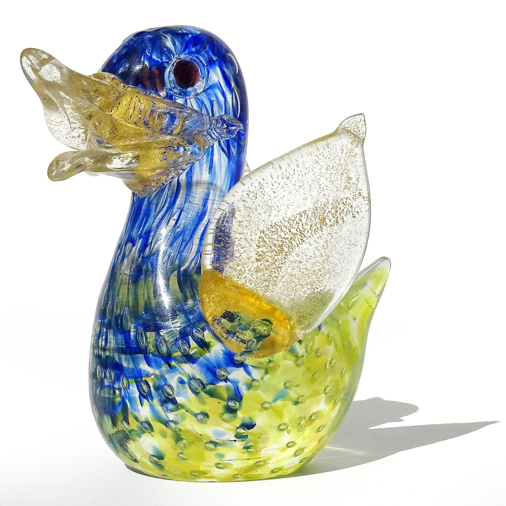 Beautiful vintage Murano hand blown cobalt blue, yellow, gold flecks and bubbles Italian art glass baby bird figurine. Documented to the Barovier e Toso Company. The bird is made with the controlled bubble 
