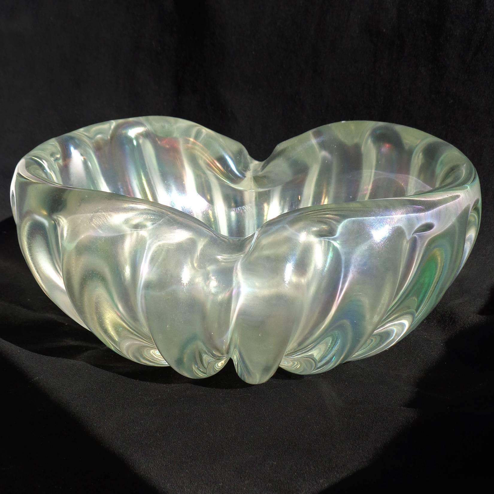 Beautiful, elegant, vintage Murano hand blown clear and iridescent / aurene Italian art glass bowl. Documented to the Barovier e Toso company. The piece is made with thick glass, and shows a rainbow of colors when the light hits, from the iridescent