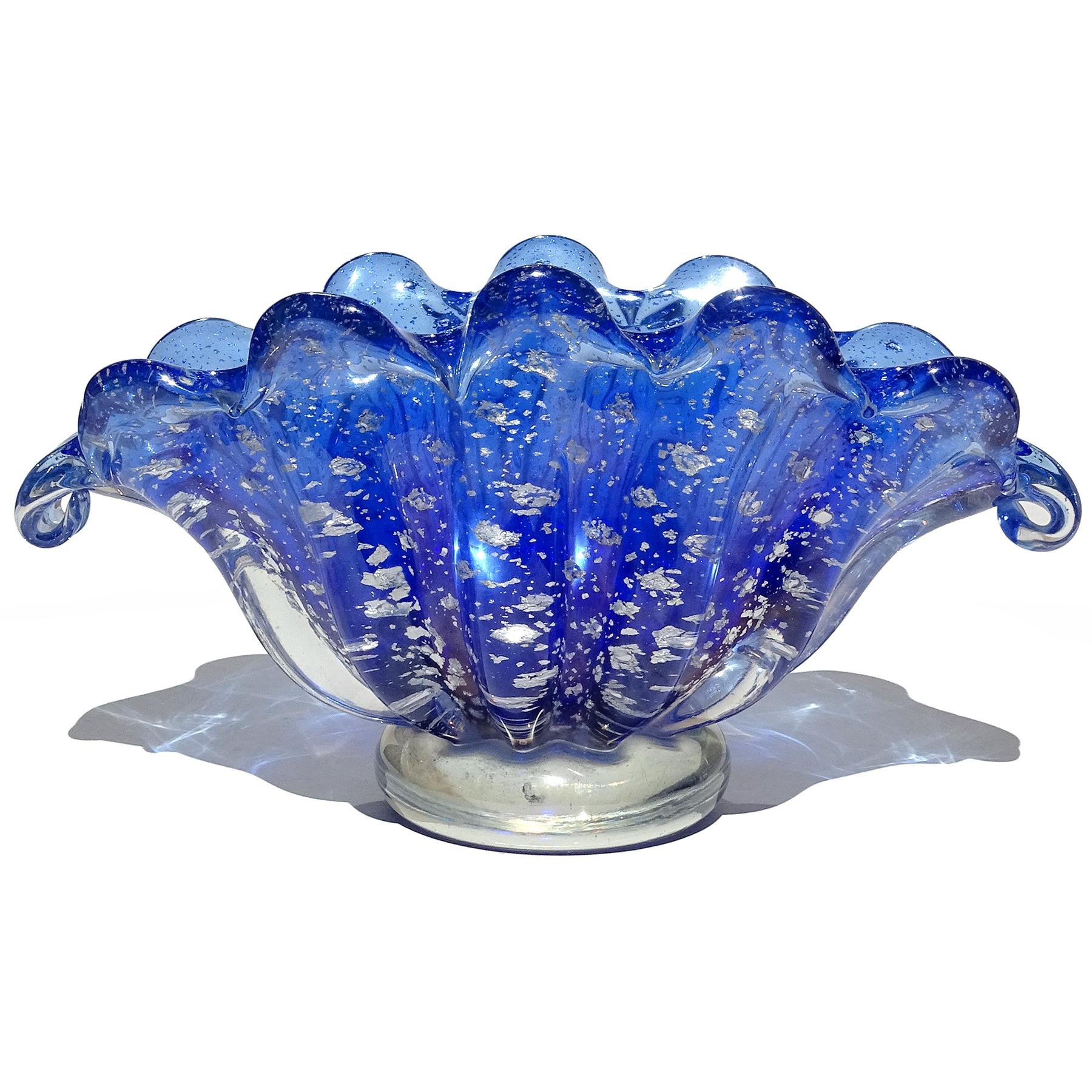 Beautiful vintage Murano hand blown cobalt blue, silver flecks, controlled bubbles Italian art glass bowl or vase. Attributed to the Barovier e Toso company. The piece has a clam shell shape with scallop rim and with applied clear foot. It also has