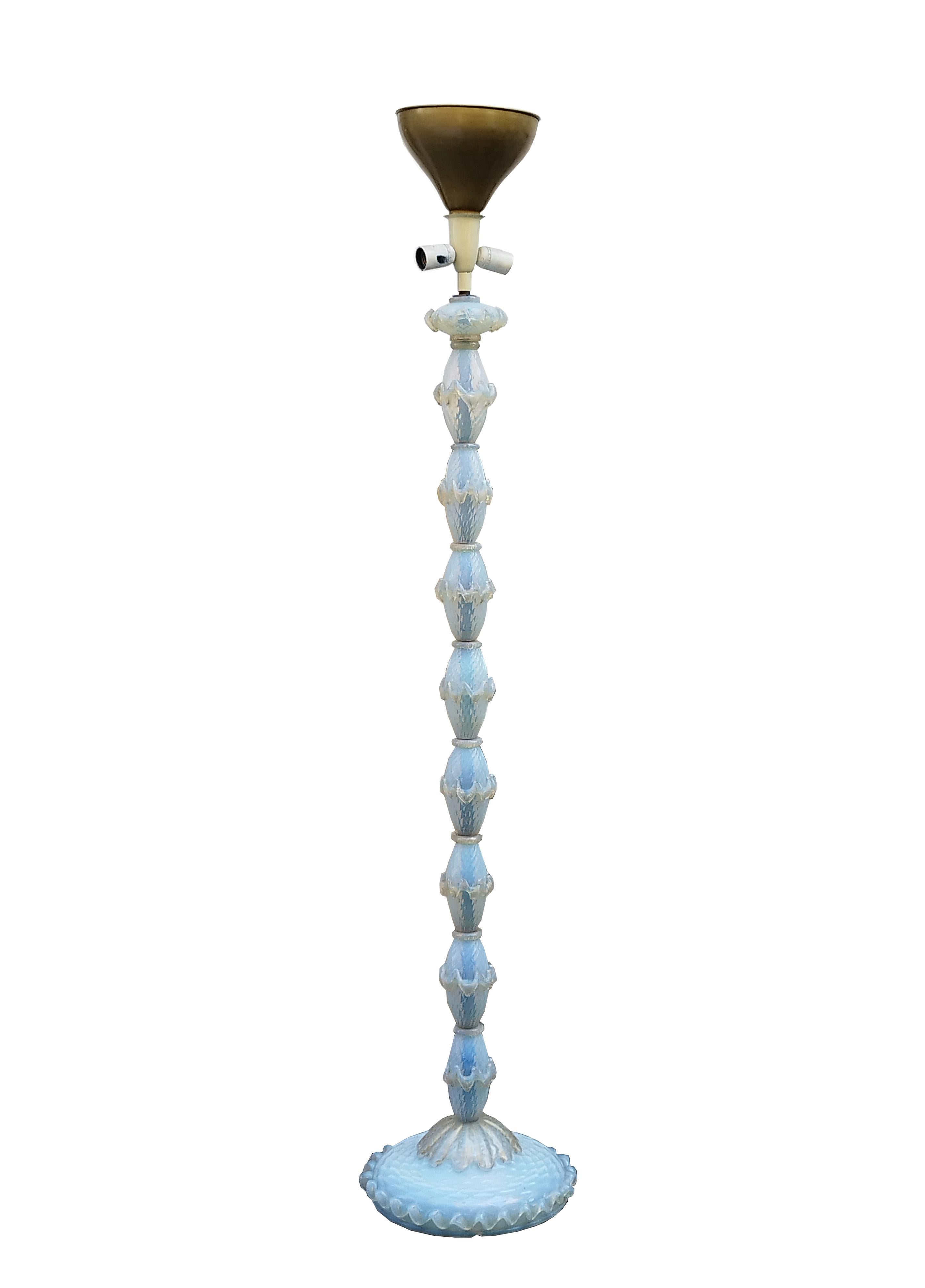 Classic-style, handcrafted floor lamp made of lightly iridescent blue diamond Murano glass by Barovier & Toso 1940.
Venetian glass represents an excellence of made in italy, for centuries worked in the furnaces on the island of Murano. In addition,