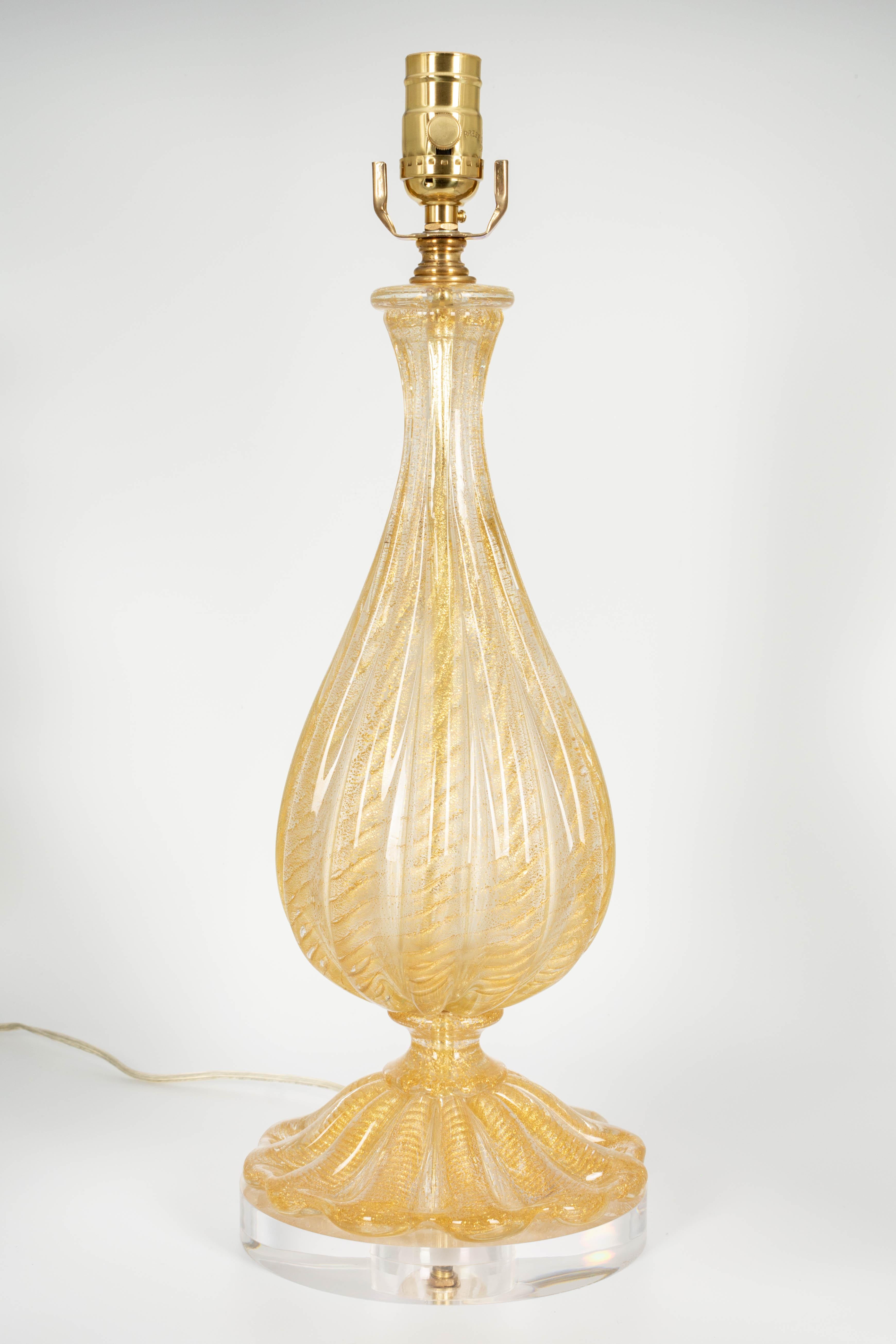 A Murano glass lamp by Barovier & Toso. Clear hand blown glass with real gold leaf inclusions in 