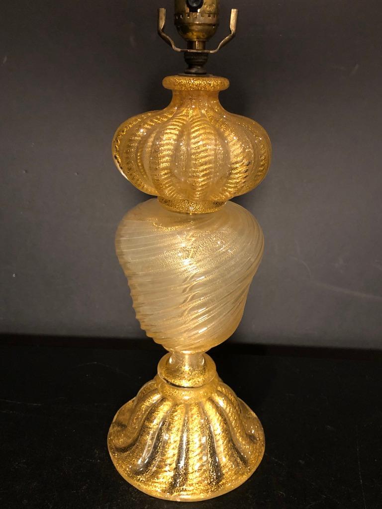 A midcentury Murano Venetian glass lamp by Barovier & Toso. Clear hand blown glass with real gold leaf inclusions. Original paper label. 
15