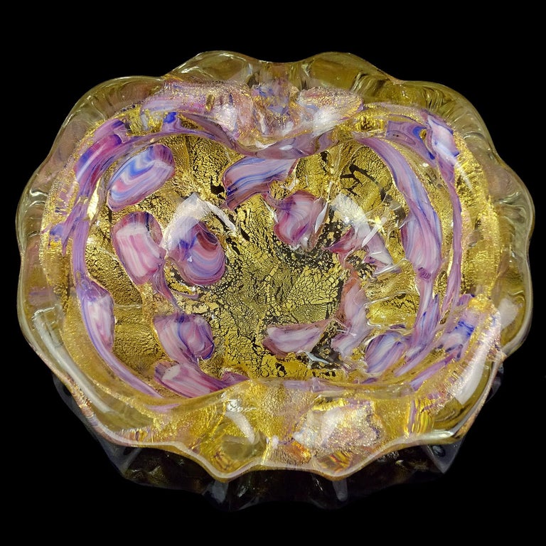 Beautiful vintage Murano hand blown gold flecks Italian art glass bowl or ashtray. Documented to the Barovier e Toso Company. Decorated with blue, purple, pink, white swirled color spots. Created with very thick and heavy glass. Profusely covered in