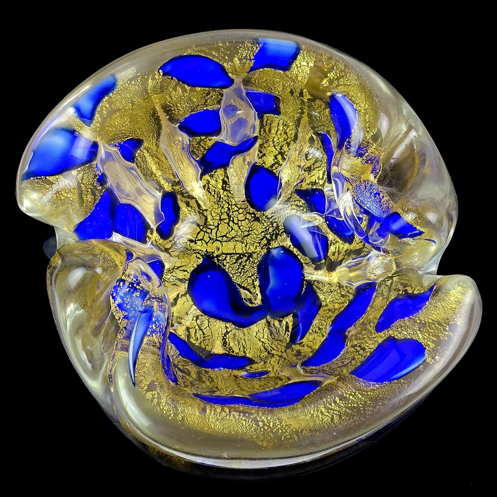 Beautiful vintage Murano hand blown gold flecks Italian art glass bowl or ashtray. Documented to the Barovier e Toso Company. Decorated with cobalt blue color spots. The bowl is created with very thick and heavy glass. It has a scissor cut rim, with
