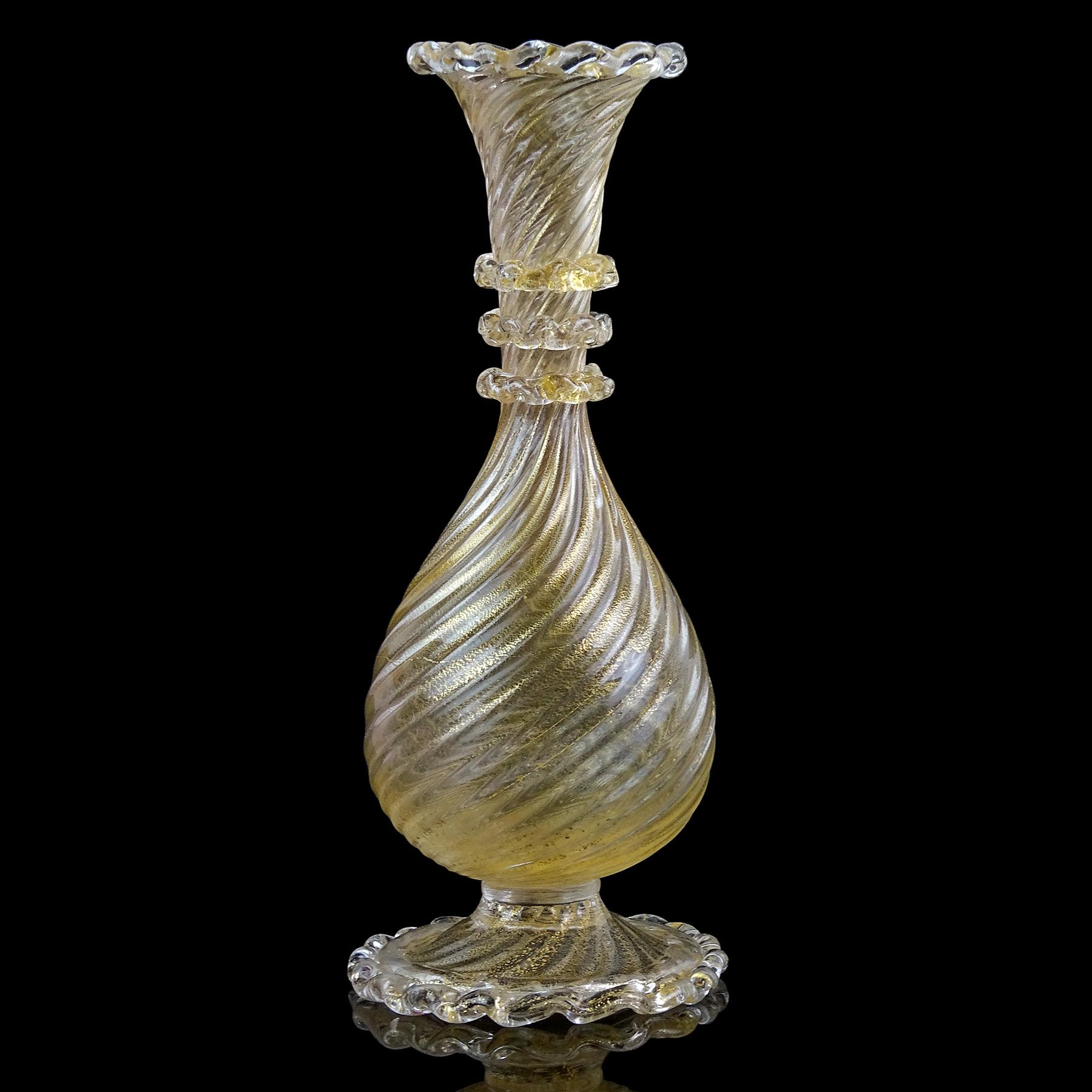 Beautiful, early Murano hand blown gold flecks Italian art glass footed flower vase. Documented to the Barovier e Toso company. The body of the vase has a ribbed pattern and 3 rigaree circles around the neck. The gold is also on the rim and bottom