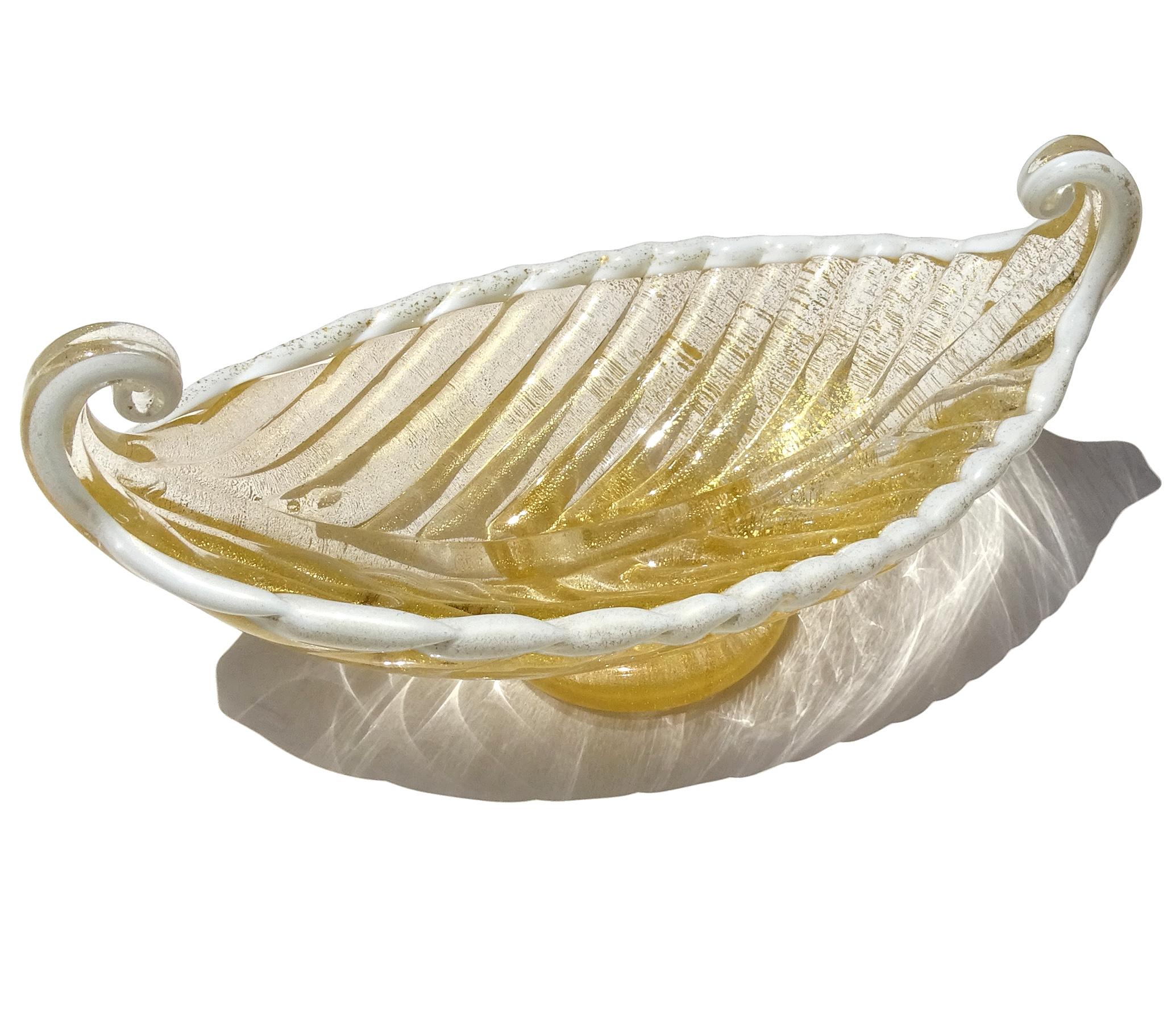 Beautiful vintage Murano hand blown gold flecks Italian art glass Venetian gondola shaped bowl. The bowl is documented to the Barovier e Toso Company. The piece has a white lined crimped edge, and applied clear disk as the base. Nicely sculpted with