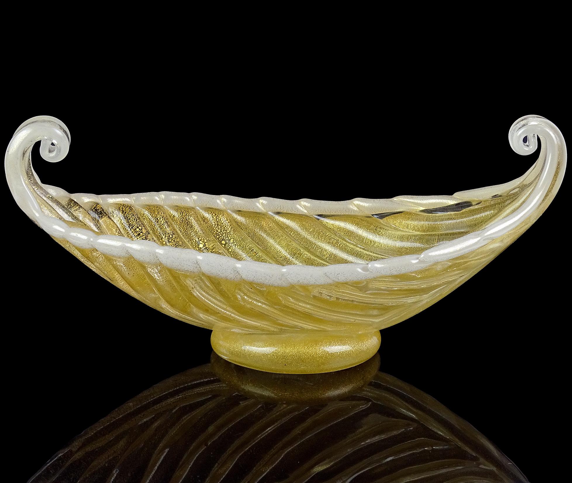 Beautiful Murano hand blown gold flecks Italian art glass Venetian gondola shaped bowl, catch all. The bowl is documented to the Barovier e Toso Company. The piece has an opaline white lined edge, and applied clear disk as the base. Nicely sculpted