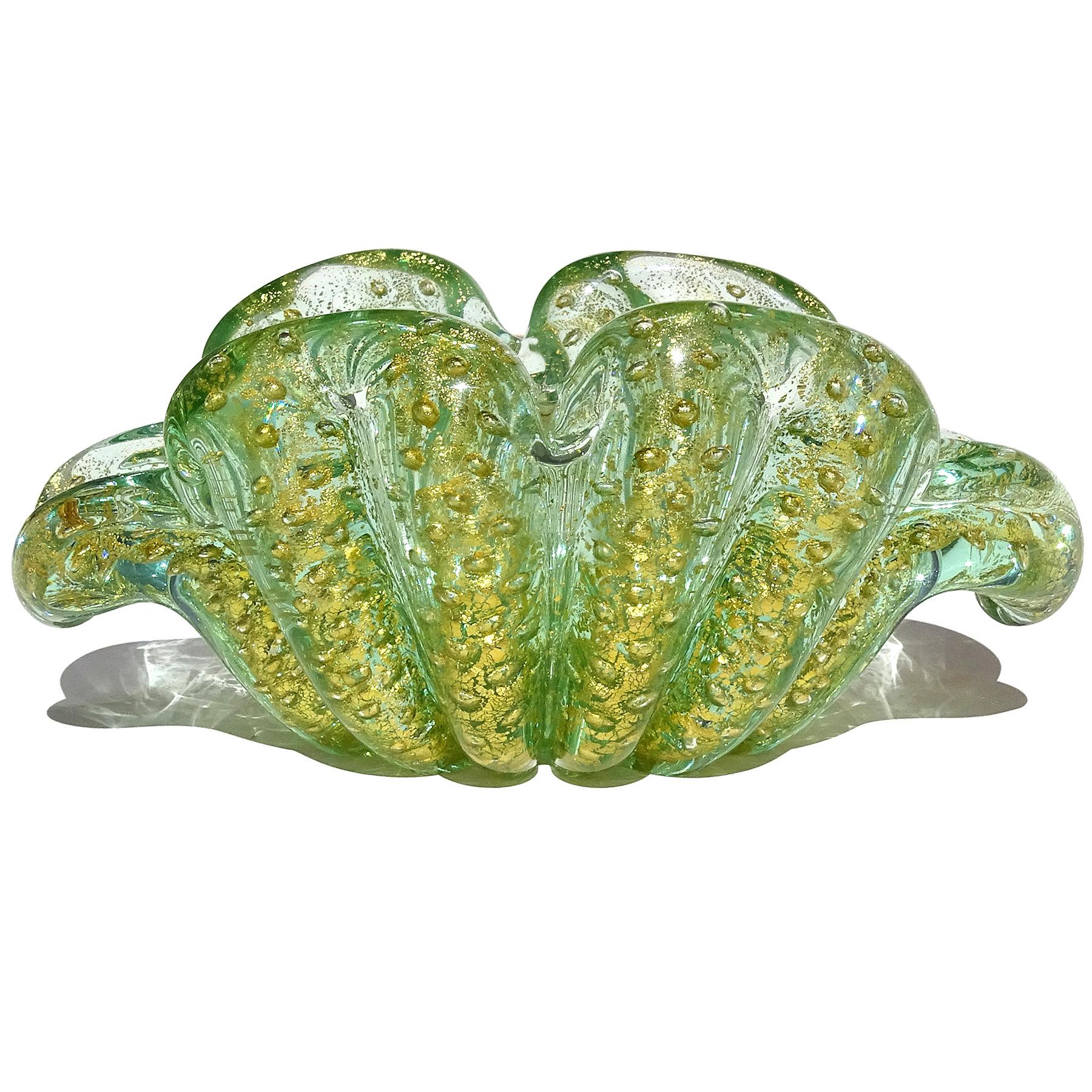 Gorgeous vintage Murano hand blown green, bubbles and gold flecks Italian art glass flower form bowl. Documented to designer Ercole Barovier for the Barovier e Toso company. The color is a transparent green, with a 