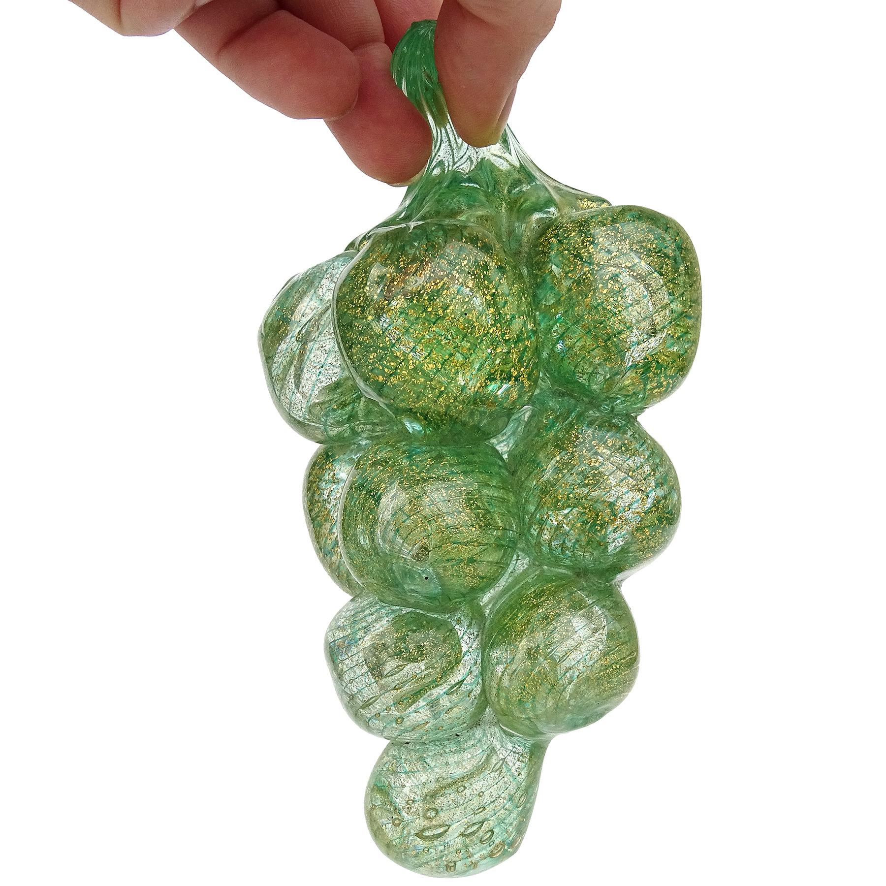Beautiful vintage Murano hand blown green stripes and gold flecks Italian art glass wrap bunch fruit sculpture / figure. Documented to the Barovier e Toso Company. The grapes are created with a 