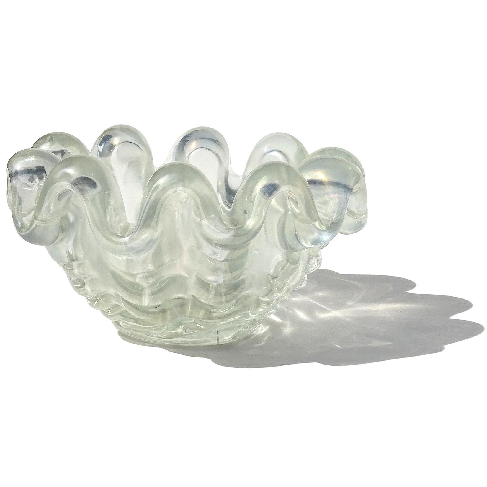 Beautiful, rare, vintage Murano hand blown clear iridescent Italian art glass sculptural conch shell bowl. Documented to designer Ercole Barovier for Barovier e Toso, circa 1940s. Created in the 