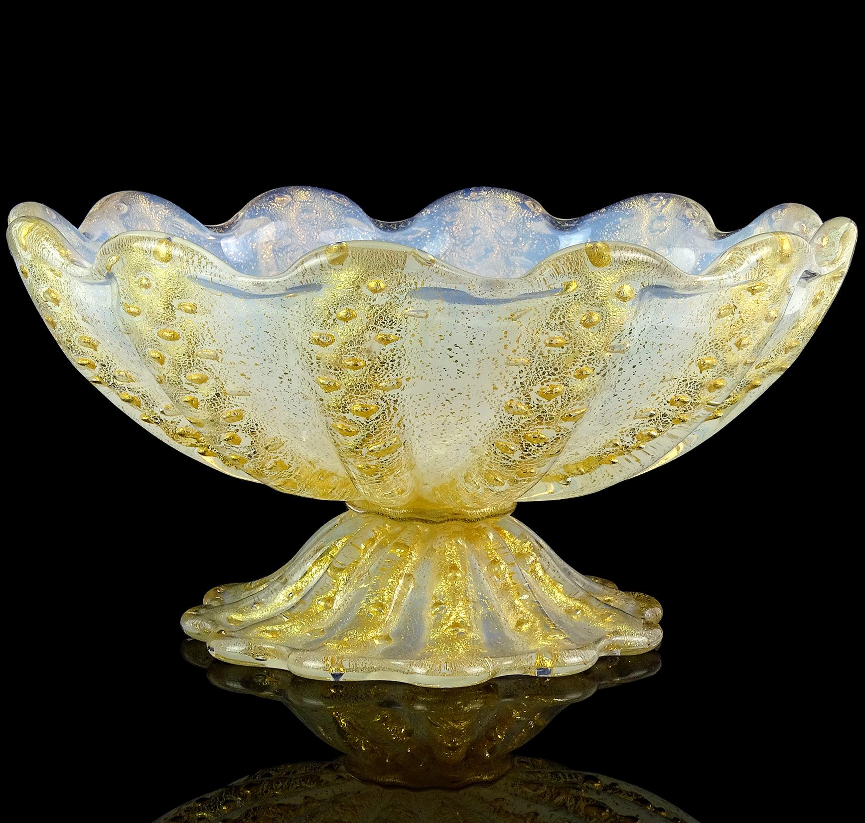 Gorgeous vintage Murano hand blown opalescent white and gold flecks Italian art glass compote bowl with scalloped design. Documented to designer Ercole Barovier, for the Barovier e Toso company. Created in a 