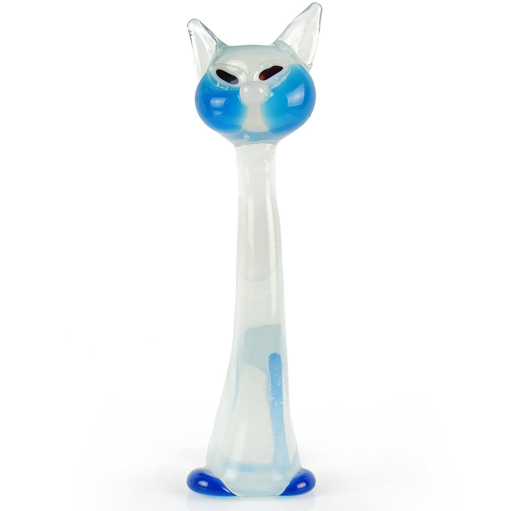 Beautiful and cute, vintage Murano hand blown opalescent white with blue accents Italian art glass kitty cat figurine sculpture. Documented to the Barovier e Toso company. The piece has a cartoonish appearance, with elongated neck and cut black /