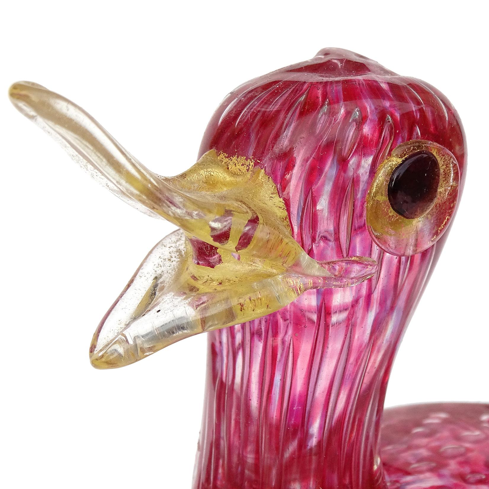 Beautiful vintage Murano hand blown clear, dark reddish pink, and bubbles Italian art glass baby bird figurine. Documented to the Barovier e Toso Company. The bird is made with the controlled bubble 