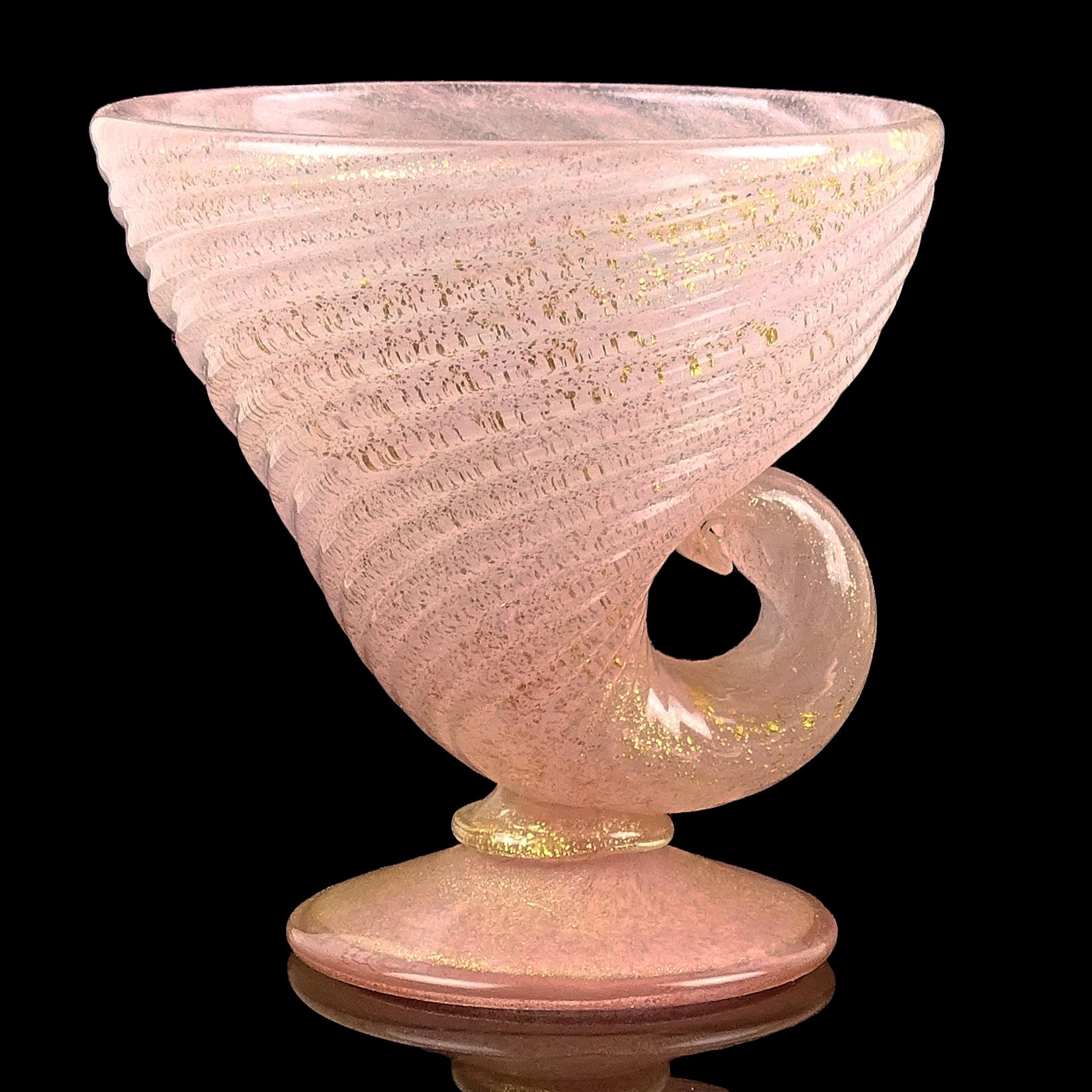 Beautiful vintage Murano hand blown pink and gold flecks Italian art glass ribbed shell shaped footed bowl / candy dish. Attributed to designer Ercole Barovier for Barovier e Toso, circa 1950s. Created in the manner of the 