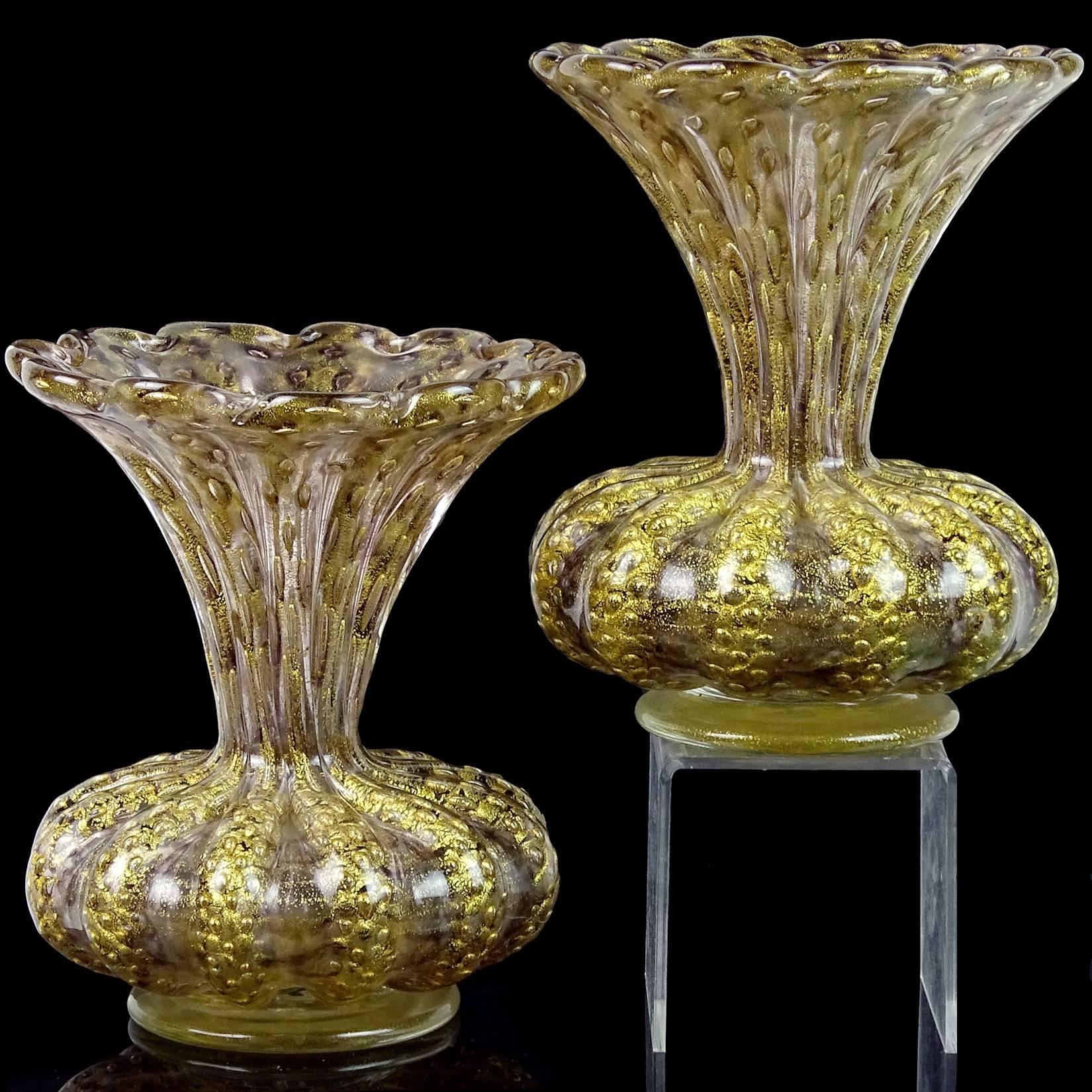 Priced per item. Gorgeous Murano hand blown, controlled bubbles, purple and gold flecks Italian art glass flower vases. Documented to designer Ercole Barovier, for the Barovier e Toso company. The pieces have a ribbed body, with a flower shaped rim.