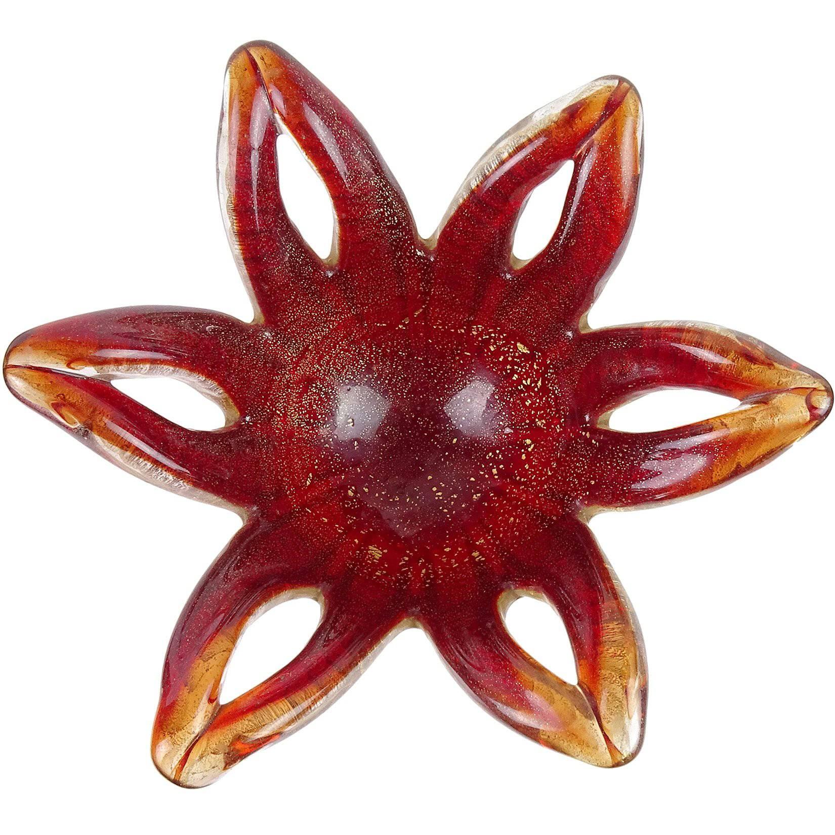 Beautiful vintage Murano hand blown red and gold flecks Italian art glass star or flower shaped bowl. Documented to designer Ercole Barovier for Barovier e Toso. The piece is profusely covered with gold leaf on the outside and light gold on the