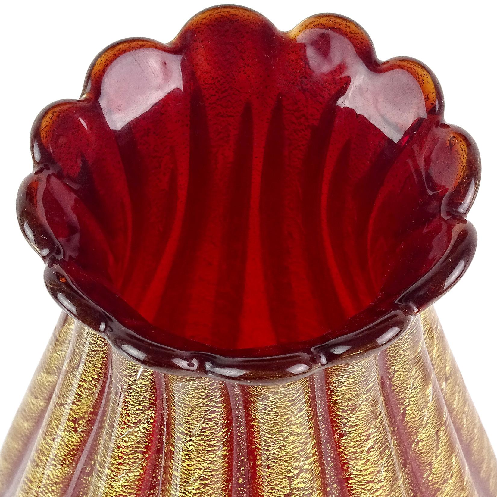 Beautiful vintage Murano hand blown red and gold flecks Italian art glass flower vase. Documented to designer Ercole Barovier, for Barovier e Toso. Created in the Cordonato D' Oro design. The vase has a scalloped rim with ribbed body. Profusely