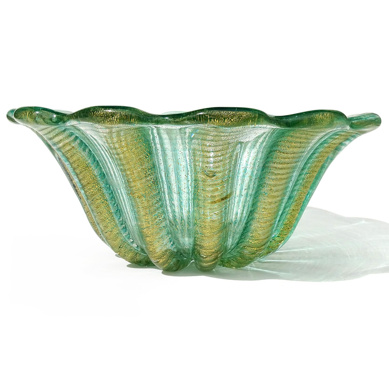 Beautiful vintage Murano hand blown green and gold flecks Italian art glass centerpiece bowl. Documented to designer Ercole Barovier, for Barovier e Toso. Created in the Cordonato D' Oro and Zebrati designs, circa 1950s. The bowl has a scalloped rim
