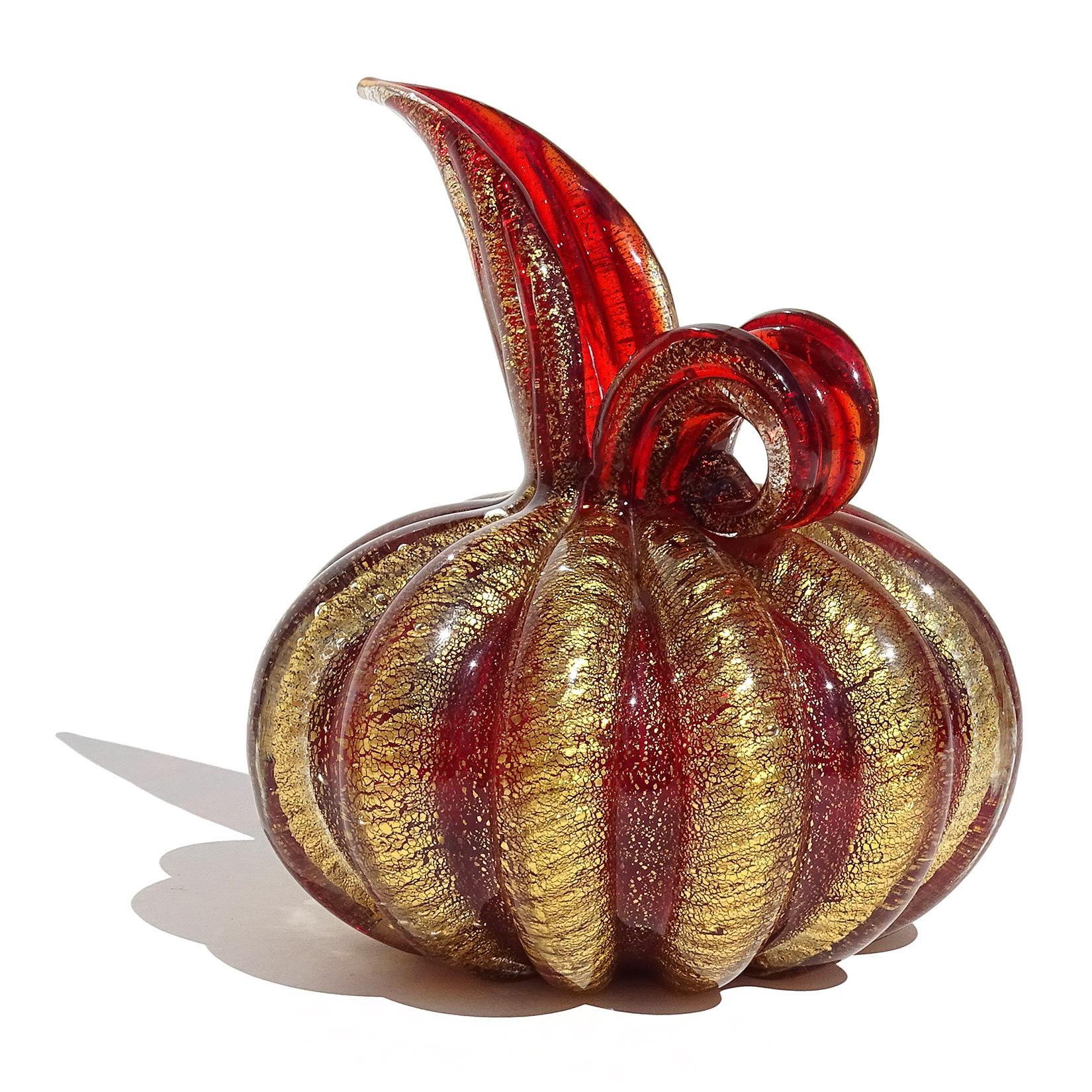 Beautiful vintage Murano hand blown deep red and gold flecks Italian art glass pitcher shaped flower vase. Documented to designer Ercole Barovier, for the Barovier e Toso company. Created in the Cordonato D' Oro design, with ropes of gold wrapped