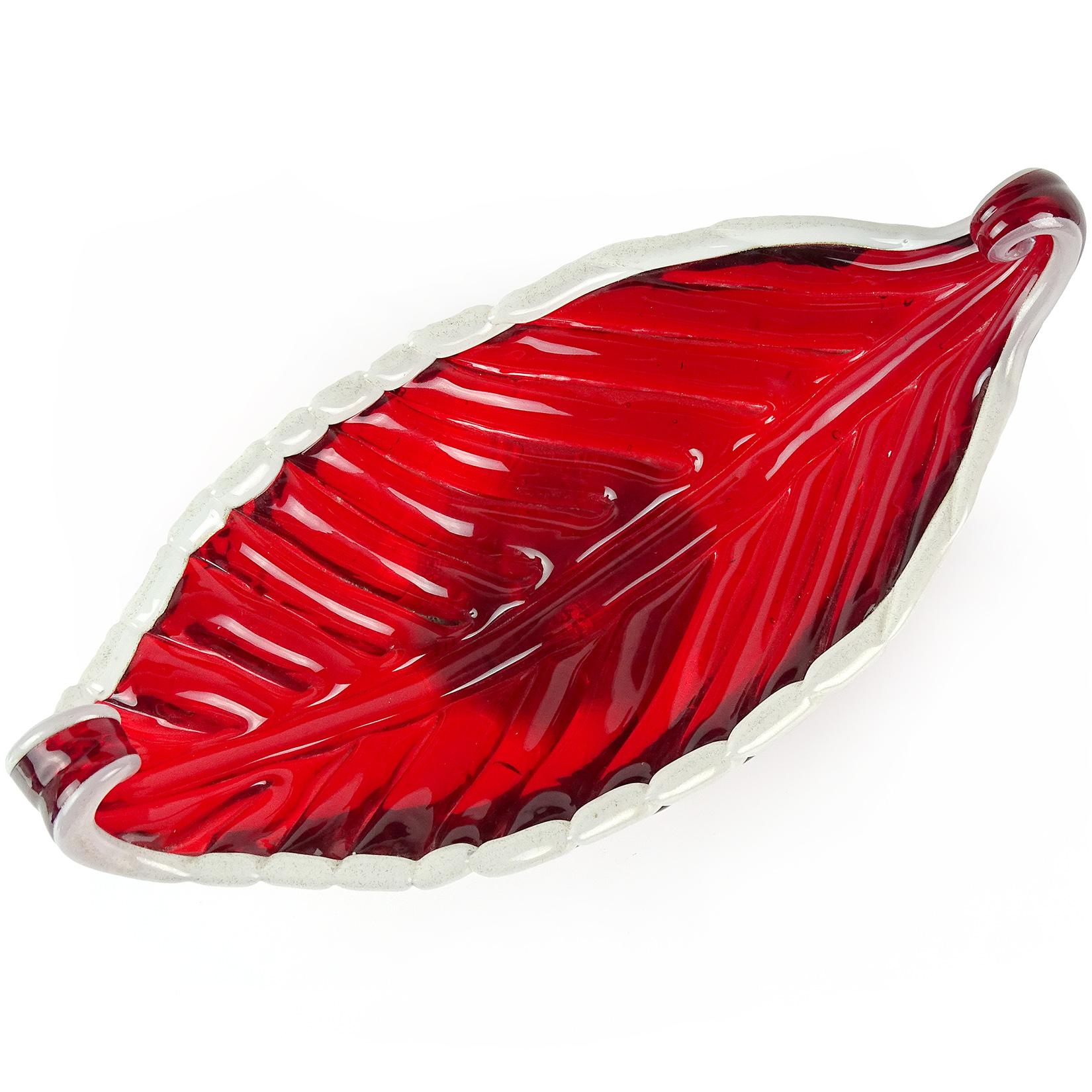 Beautiful Murano hand blown red and gold flecks Italian art glass Venetian gondola shape bowl, catch all. Documented to the Barovier e Toso company. The piece has a white lined edge and applied white disk with gold leaf. Measures 8 3/4
