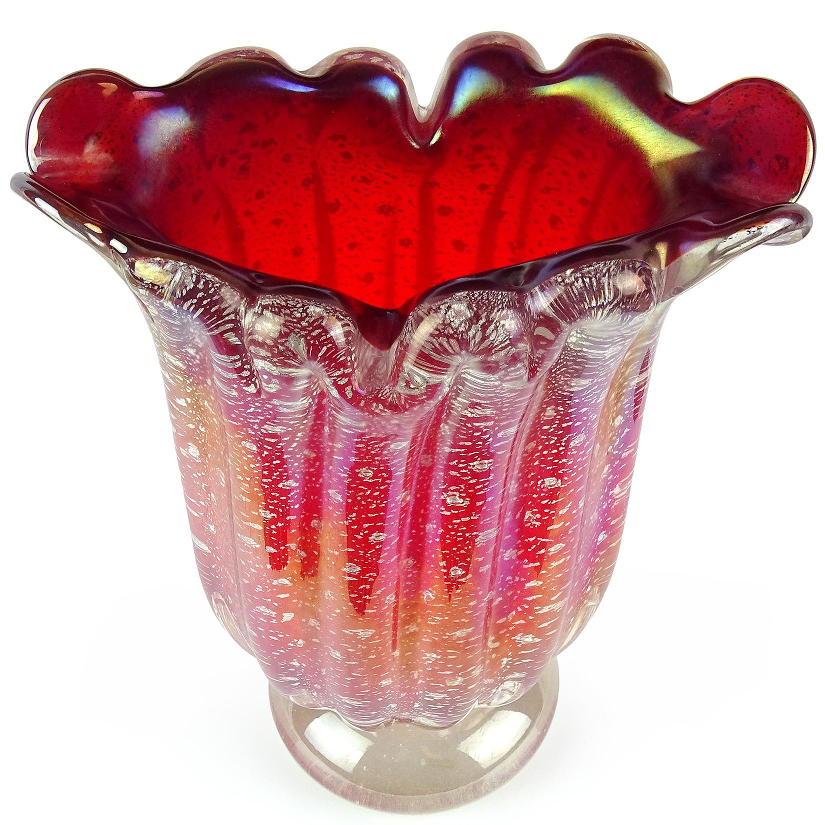 Beautiful vintage Murano hand blown deep red, silver flecks, controlled bubbles Italian art glass flower vase. Attributed to the Barovier e Toso company. The piece has a crimped rim and applied foot. It also has a heavy iridescent surface, ribbed