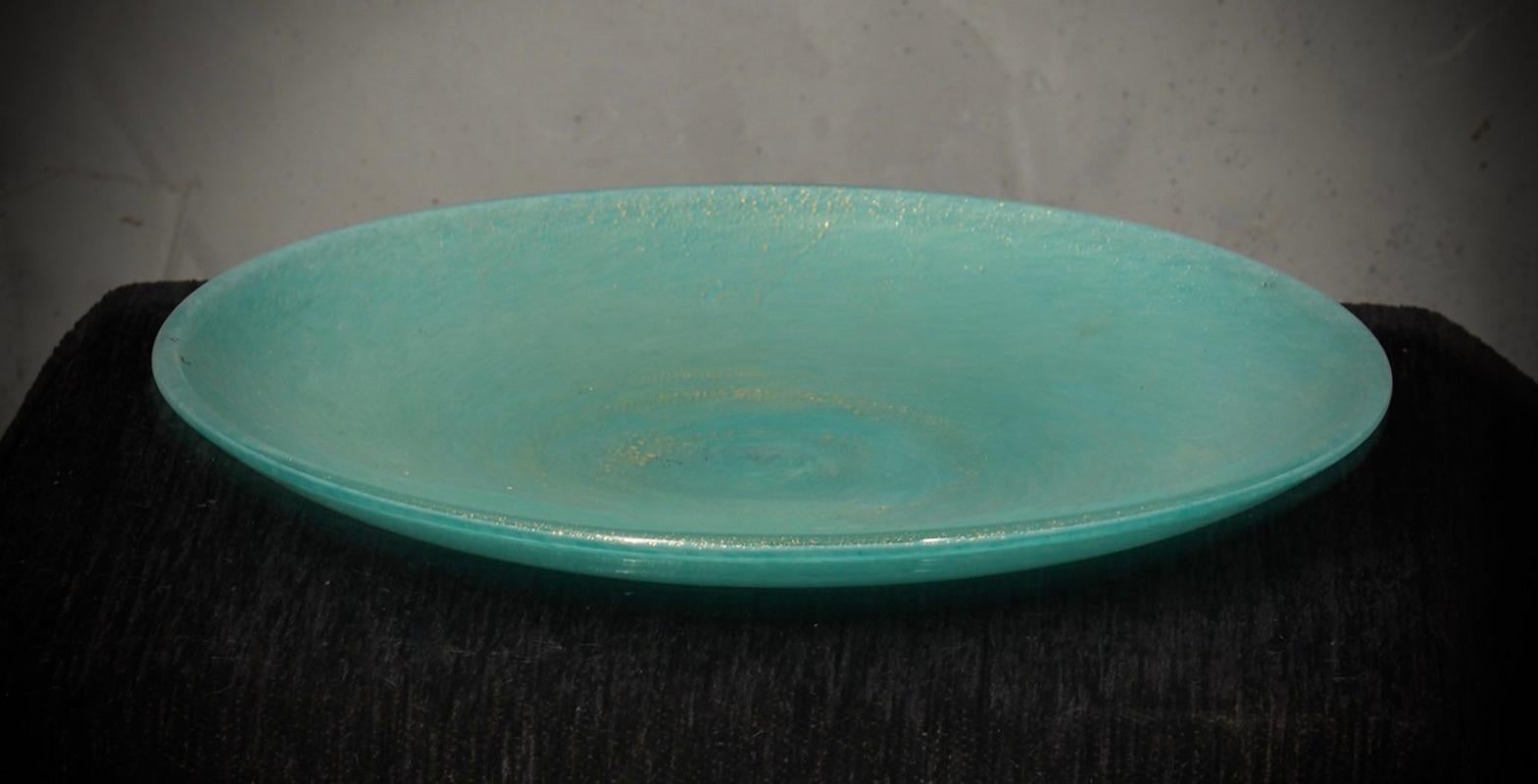 With its unique features and meticulous attention to detail, this piece is a testament to the innovative vision and artistic sensibility of the Barovier & Toso furnace.

A highly sought-after plate from the 1980s with a light blue and aventurine