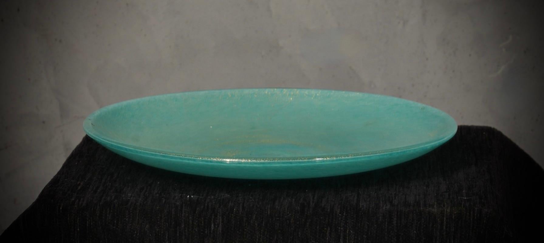 With its unique features and meticulous attention to detail, this piece is a testament to the innovative vision and artistic sensibility of the Barovier 
Toso furnace.

A highly sought-after plate from the 1980s with a light blue and aventurine