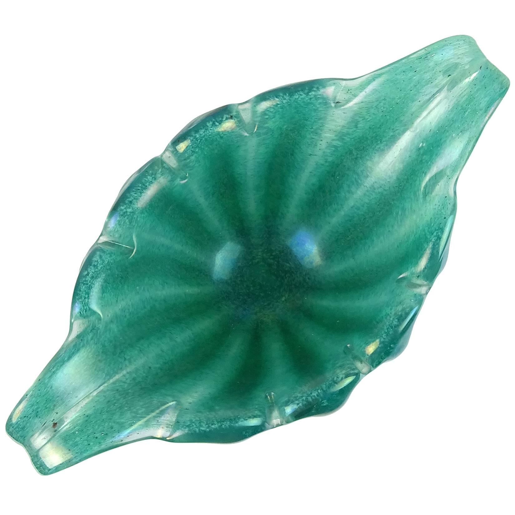 Rare Murano hand blown iridescent surface green art glass flared rim ribbed bowl. Documented to designer Ercole Barovier for Barovier e Toso, in the Eugenio technique. The piece is fully signed underneath. Measures: 9 1/4” long.
 