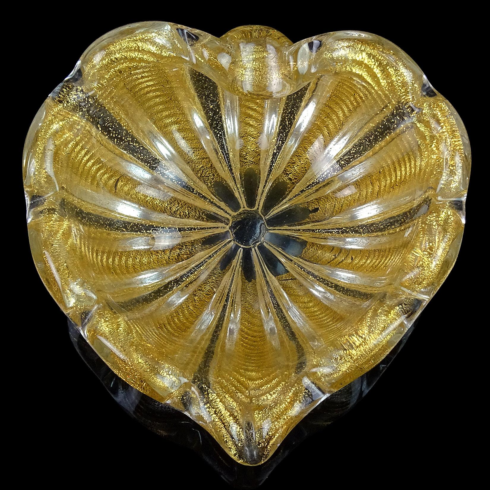 Beautiful vintage Murano hand blown gold flecks Italian art glass heart shaped bowl. Documented to designer Ercole Barovier for the Barovier e Toso Company. The bowl has a ribbed pattern and is profusely covered in gold leaf. Would make a great