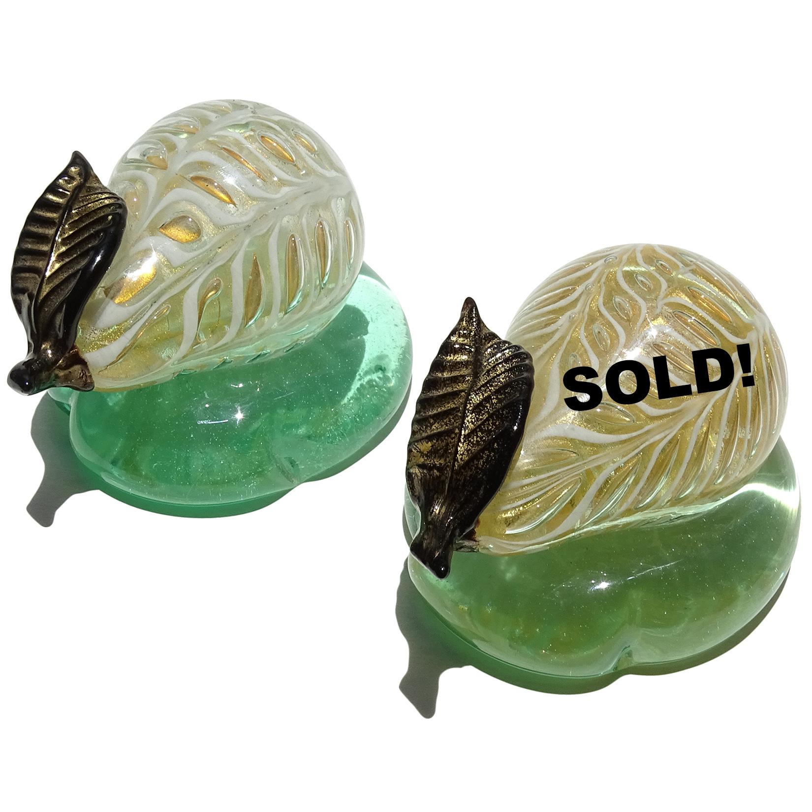 Only 1 left - Beautiful vintage Murano hand blown white and gold flecks Italian art glass pear paperweight. Documented to designer Ercole Barovier for the the Barovier & Toso company. Created in the Graffitto design, and stand on a green base. Mid