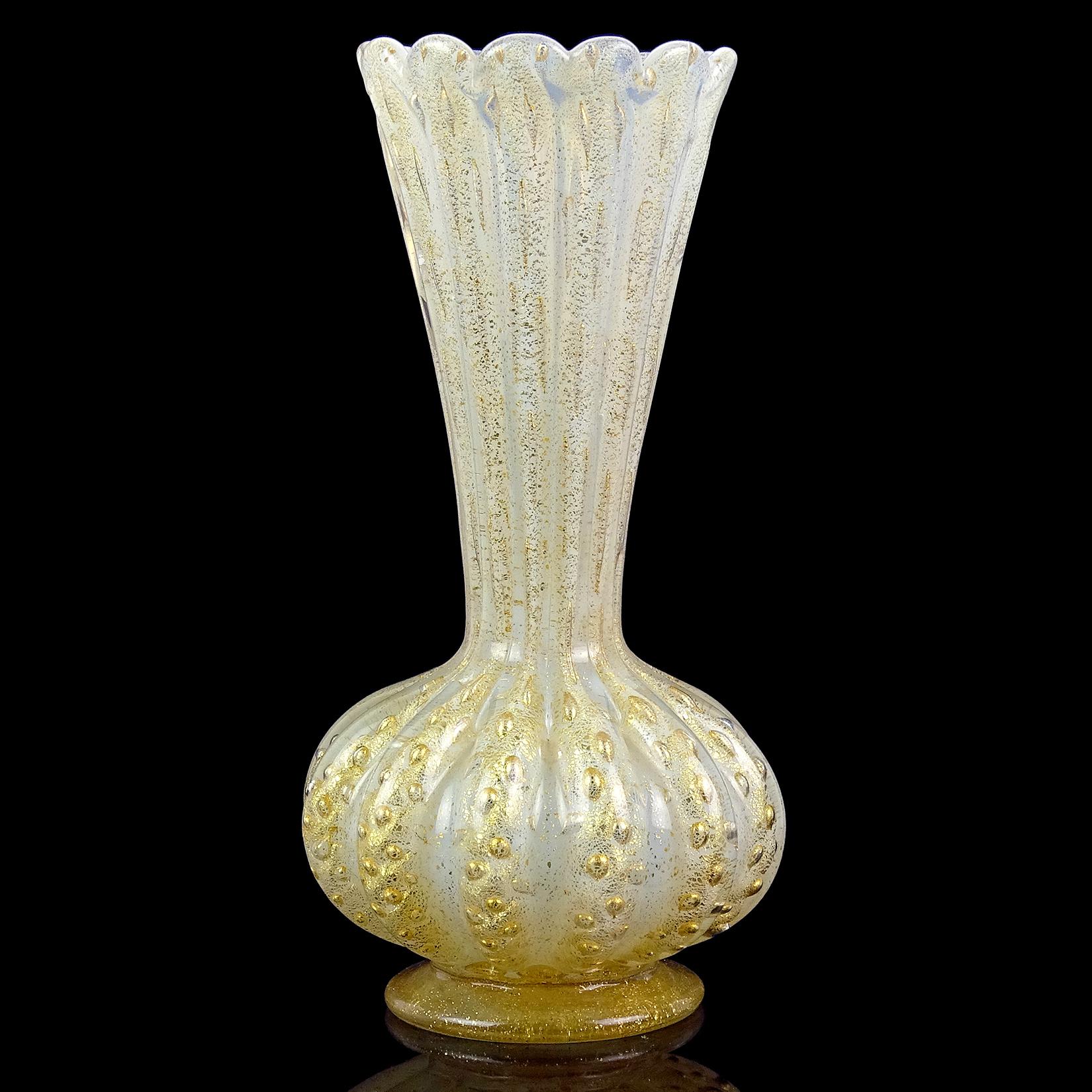 Beautiful vintage Murano hand blown opalescent white, controlled bubbles and gold flecks Italian art glass flower vase. Documented to designer Ercole Barovier, for the Barovier e Toso company. It still retains a large rectangular 