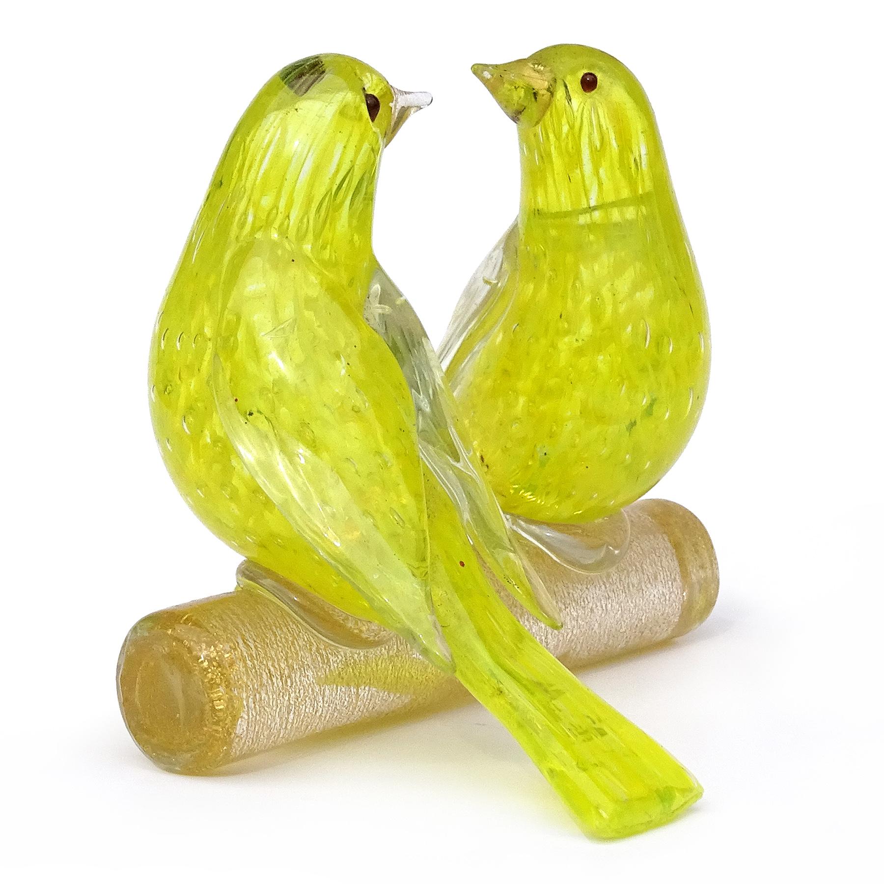 Beautiful vintage Murano hand blown bright yellow, controlled bubbles and gold flecks Italian art glass love birds sculpture. The piece is documented to the Barovier e Toso Company. The two canary / finches are nicely sculpted, sitting on a branch,