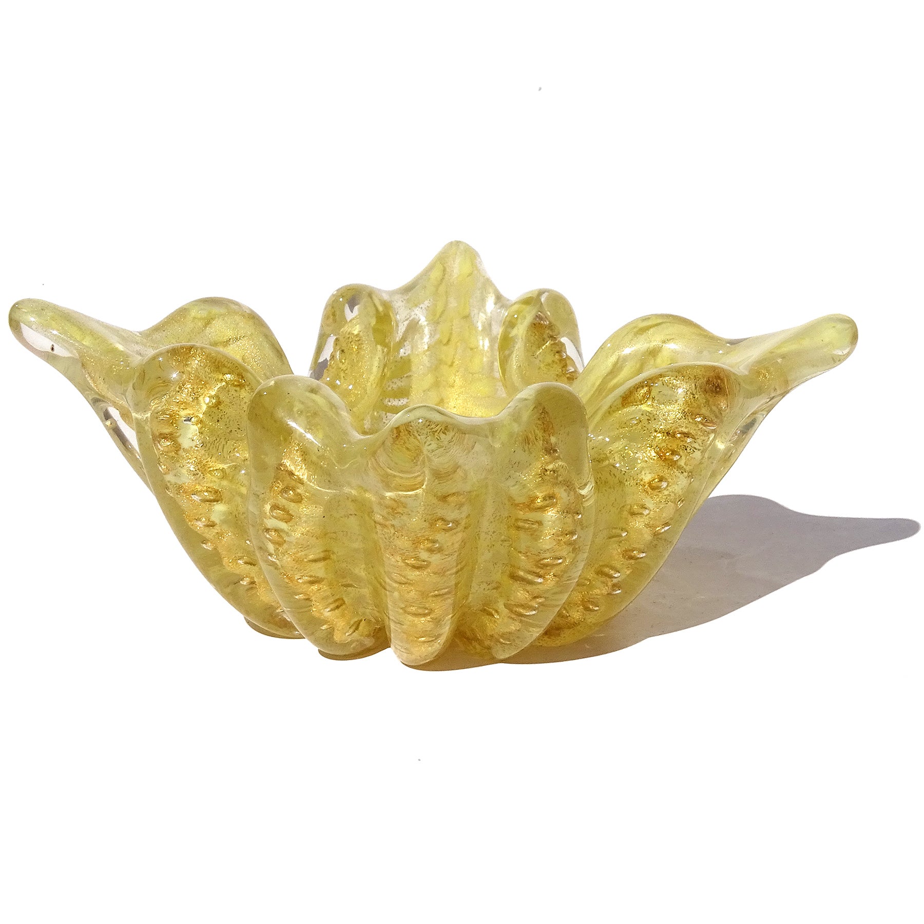 Beautiful vintage Murano hand blown bright yellow and gold flecks Italian art glass ribbed with spike corners bowl / cigar ashtray. Documented to designer Ercole Barovier for the the Barovier e Toso company. The color is a made with pigments added