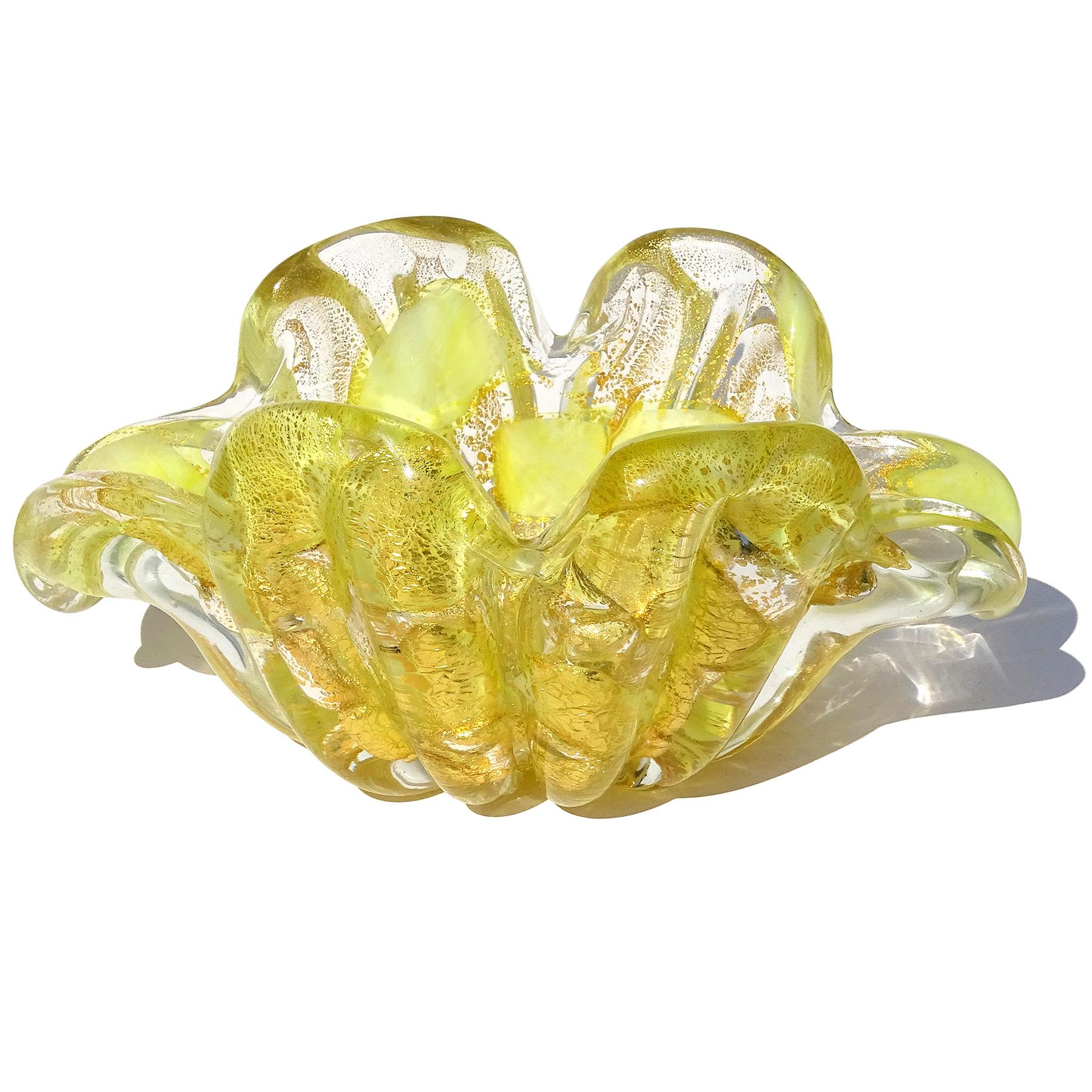 Beautiful vintage Murano hand blown bright yellow and gold flecks Italian art glass flower form bowl or ashtray. Documented to the Barovier e Toso company. The bowl is decorated with yellow color spots and very thick and heavy glass. It has a ribbed