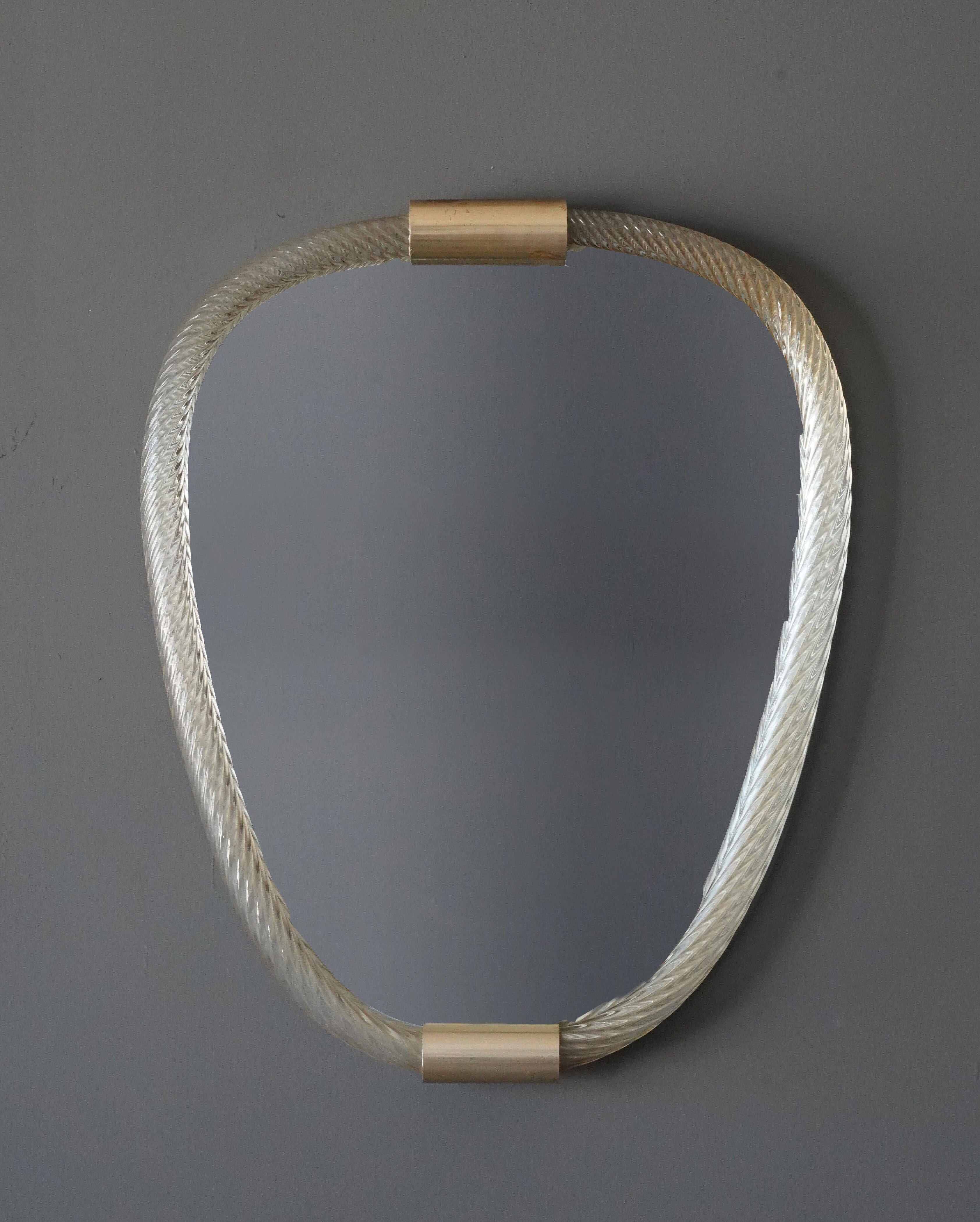 An organic wall mirror. Attributed to Barovier & Toso, Italy, 1950s. 

Other designers of the period include Fontana Arte, Max Ingrand.
    