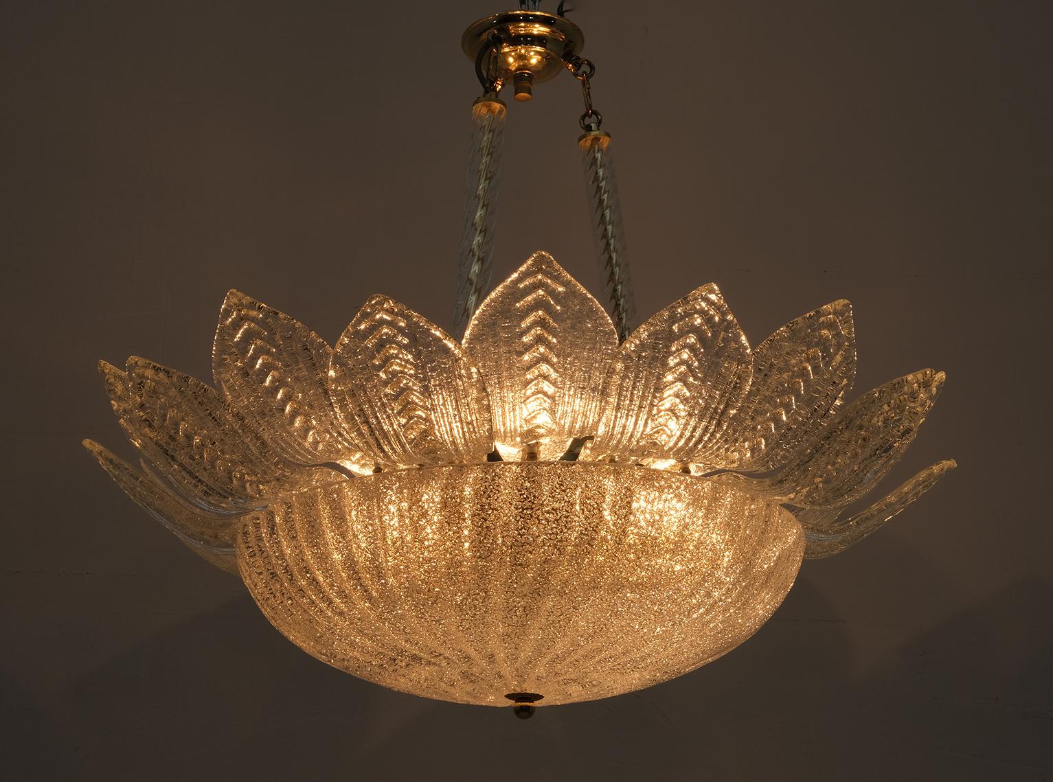 This chandelier, in the style of Barovier & Toso in the 70s, is made of Murano Gold Graniglia glass and brass, has six lights.

The Barovier artistic glass factory has existed since the mid-13th century and is therefore the sixth oldest family