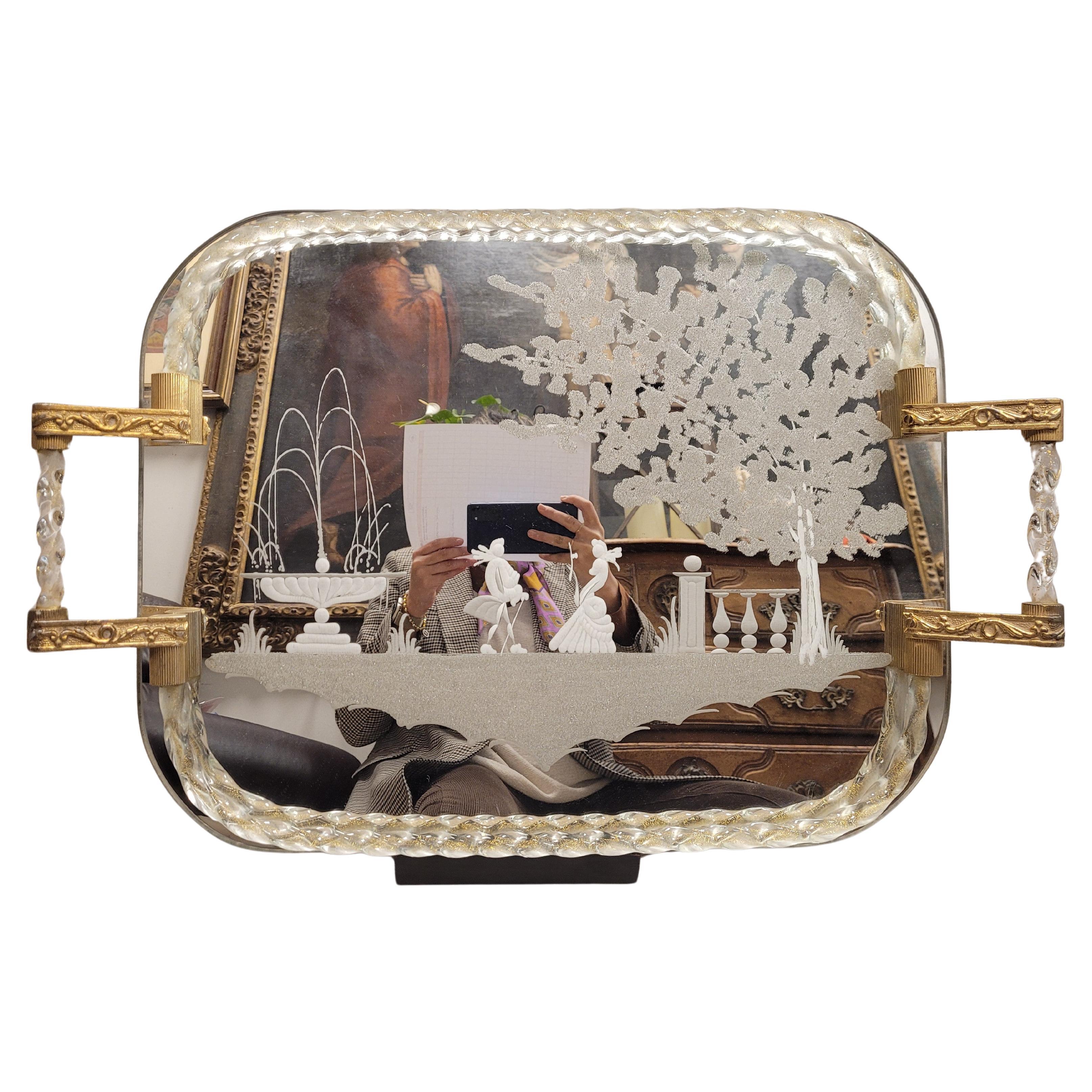 One of a kind and Iconic vanity tray with handles; The rectangular body is a mirror with rounded corners and has been carved from the stone wheel on top by depicting a courtship scene showing a court couple dressed in all their elegant clothing in a