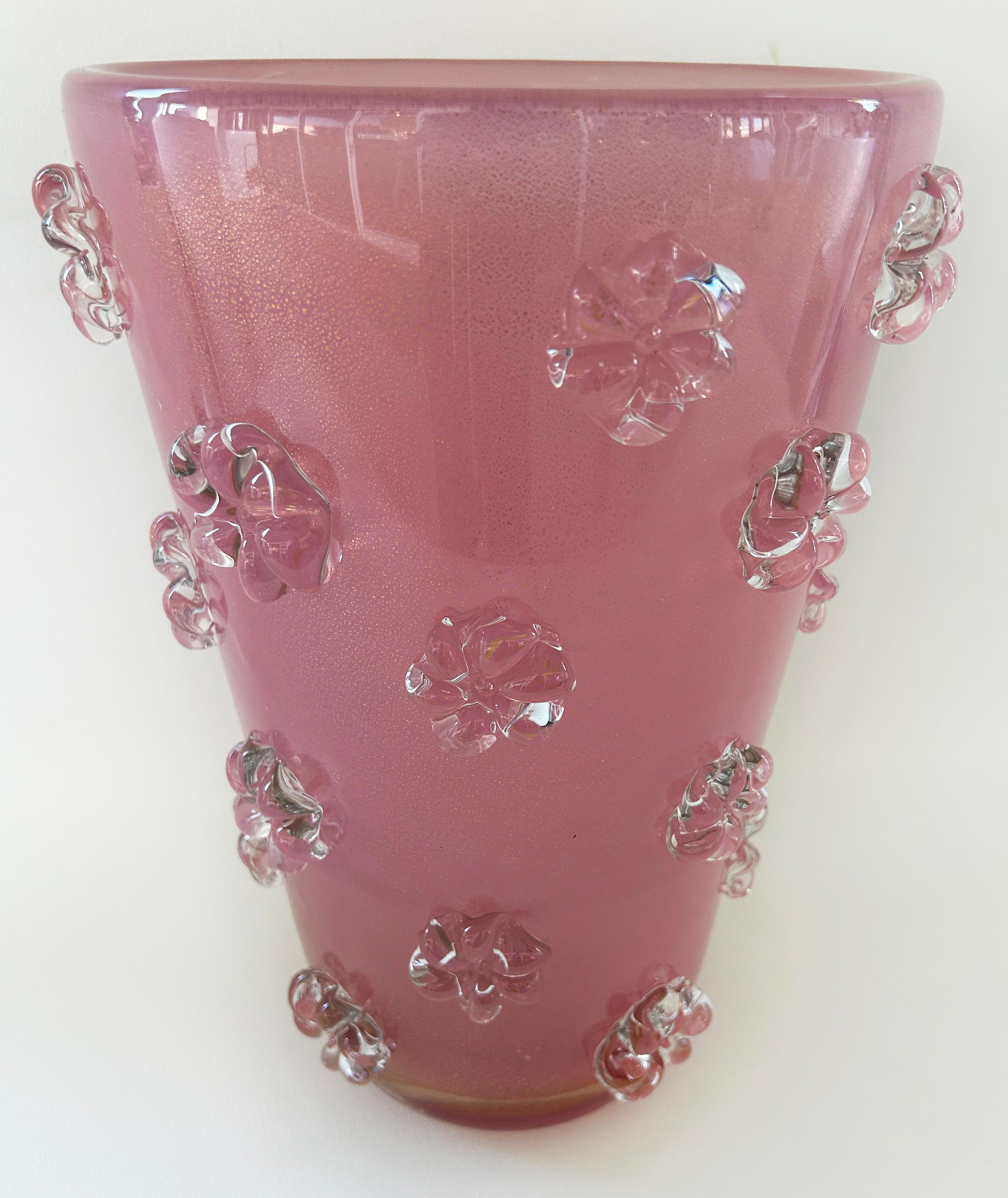 Barovier&Toso Murano Glass Vase, Gold Inclusions, Floral Applications

Offered for sale is a Murano glass vase in pink with gold inclusions and clear glass floral applications that is attributed to Barovier&Toso. The vase no longer retains the
