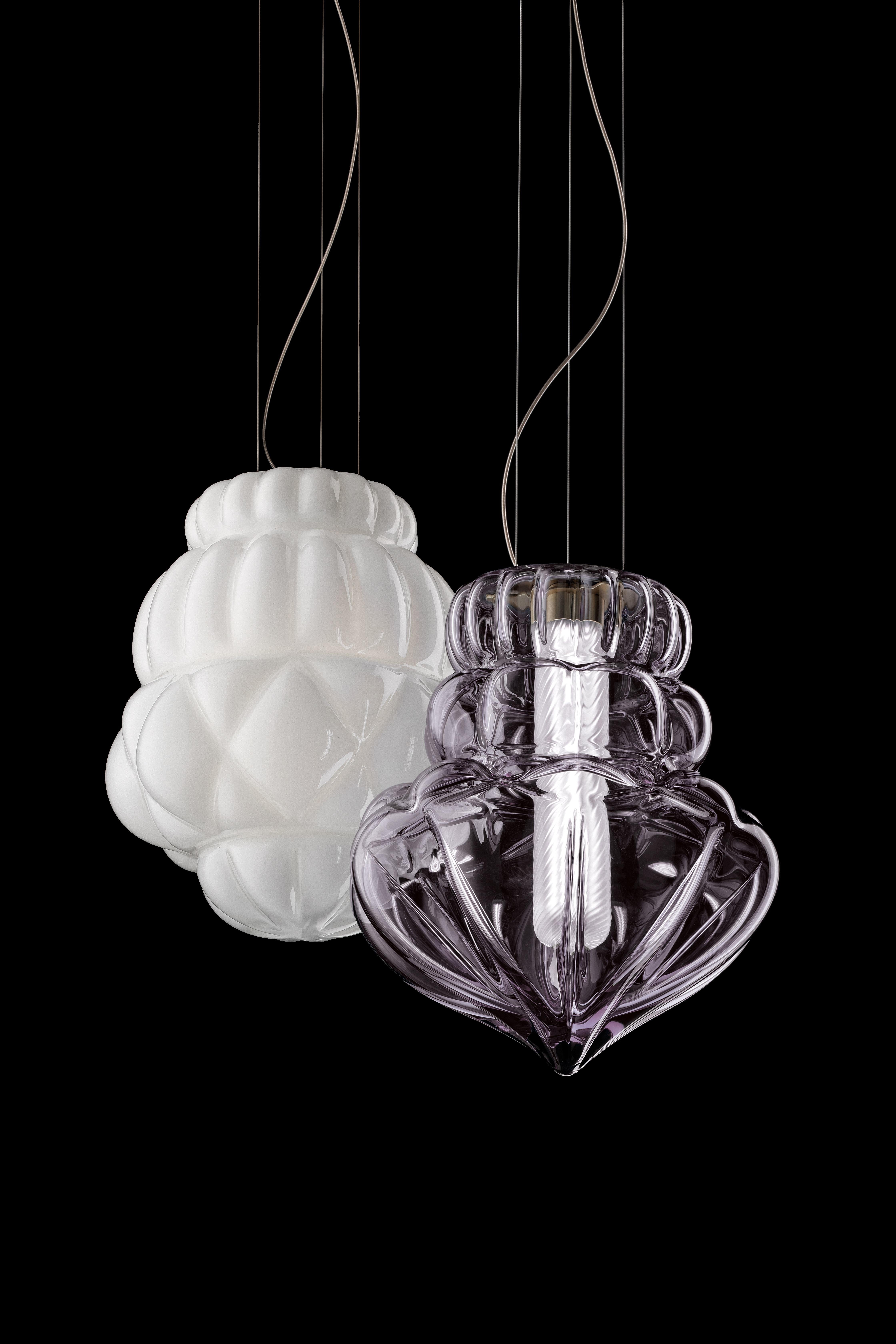 Vallonnè is a collection of suspension lamps in Venetian Crystal, mouth blown and crafted by hand. Action/reaction, expansion/retraction: the idea of the design stems from this system of forces and tensions, where the surfaces of the object reveal a