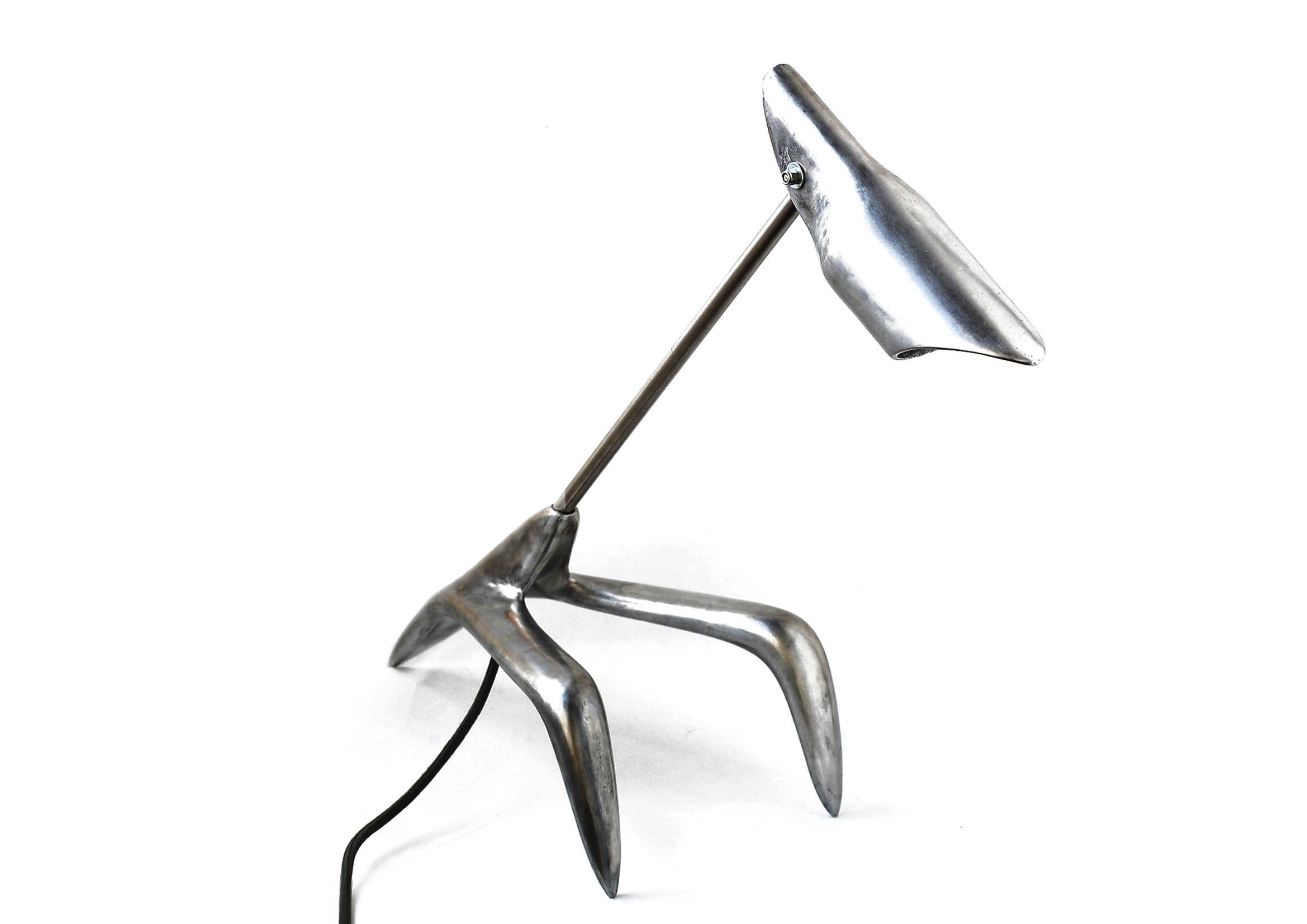 Barracuda Desk Lamp by Lucio Rossi
Dimensions: D 20 x W 65  x H 45  cm
Material: Aluminum, Stainless steel.
Weight: 2,35kg

The Barracuda is a desk lamp designed for large tables, with an adjustable  head that rotates 360° and tilts. The collectible