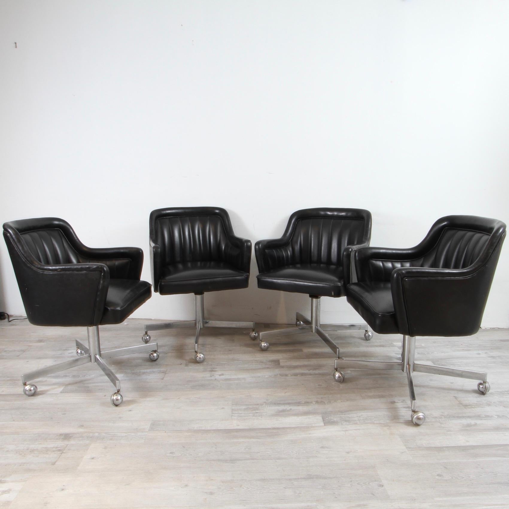 Nice surviving set of channel black desk chairs in original black naugahyde with chrome castors. We have 8 in total. All presentable as is, but in need of reupholstery after 50 years. 

Ward Bennett, November 17, 1917 – August 13, 2003) was an