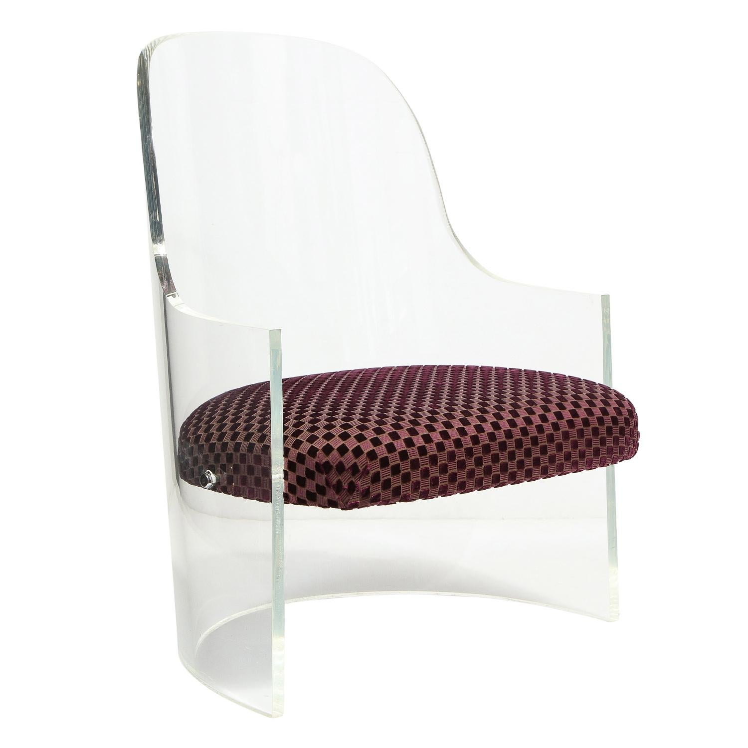 Sculptural barrel back lounge chair in thick Lucite with upholstered seat, American 1970's. This chair has nice scale and is beautifully made. The lucite has been professionally cleaned an polished.