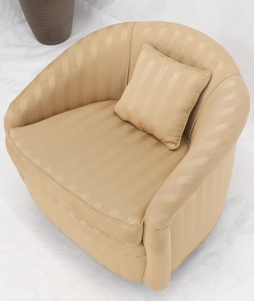 Milo Baughman swivel barrel back lounge chair.