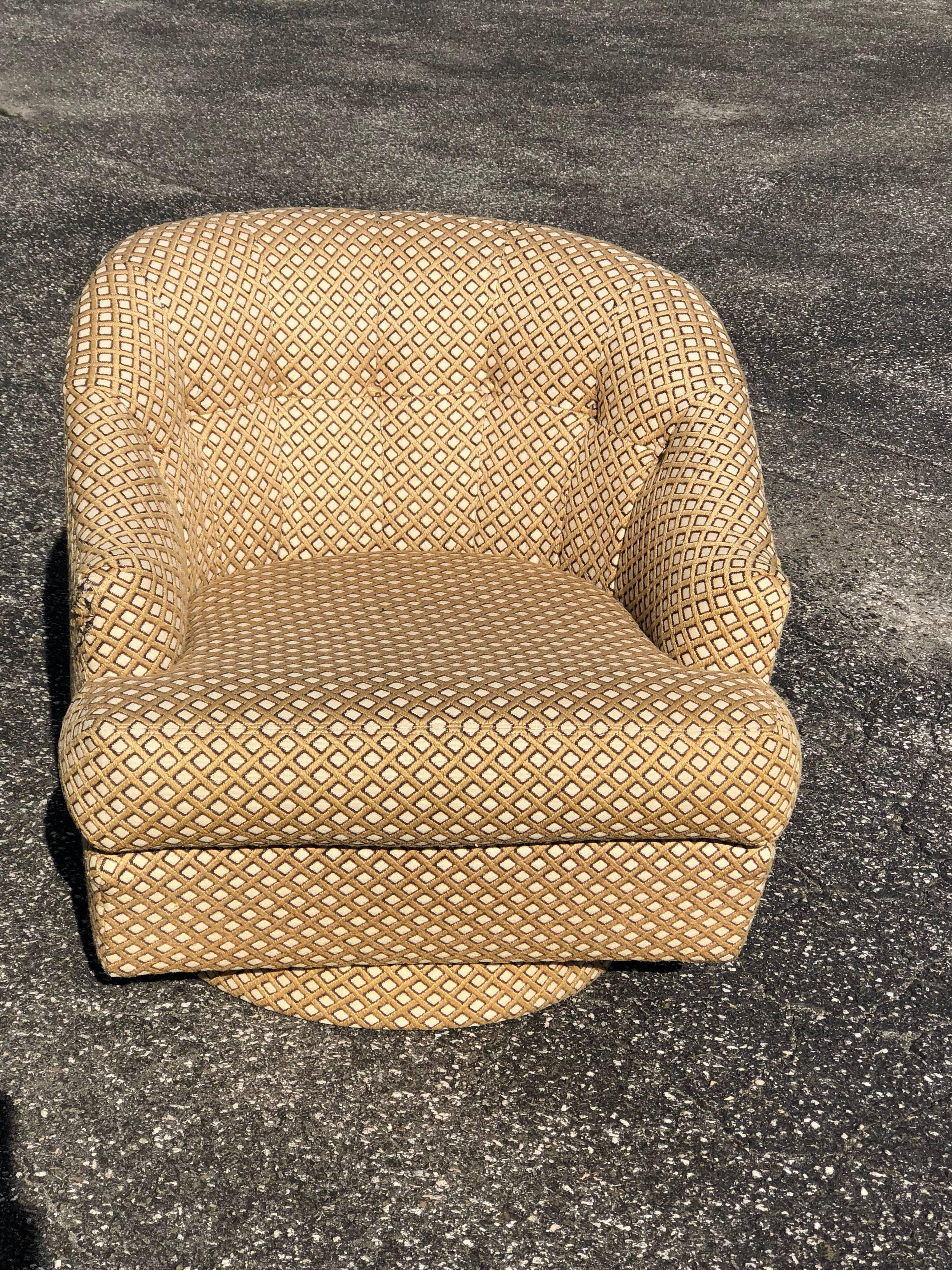 Barrel back swivel club chair with ottoman by Directional. Inspired by Milo Baughman's style. Nice rounded low barrel back with square ottoman. Fabulous gold tone geometric weaved fabric but could use a re upholstery. Ottoman missing two castors